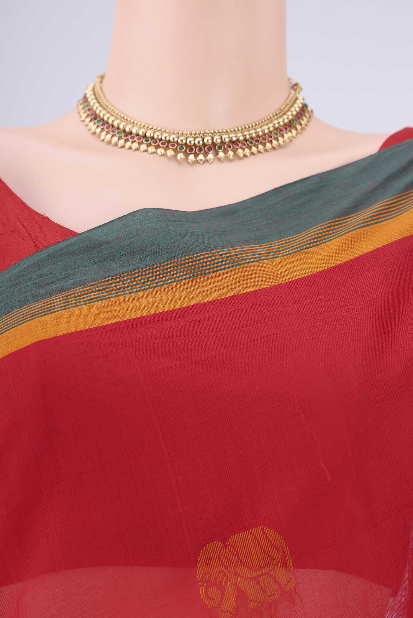 Border image of Red Coimbatore Cotton Saree with Thread Butta on the body and Plain Border. 