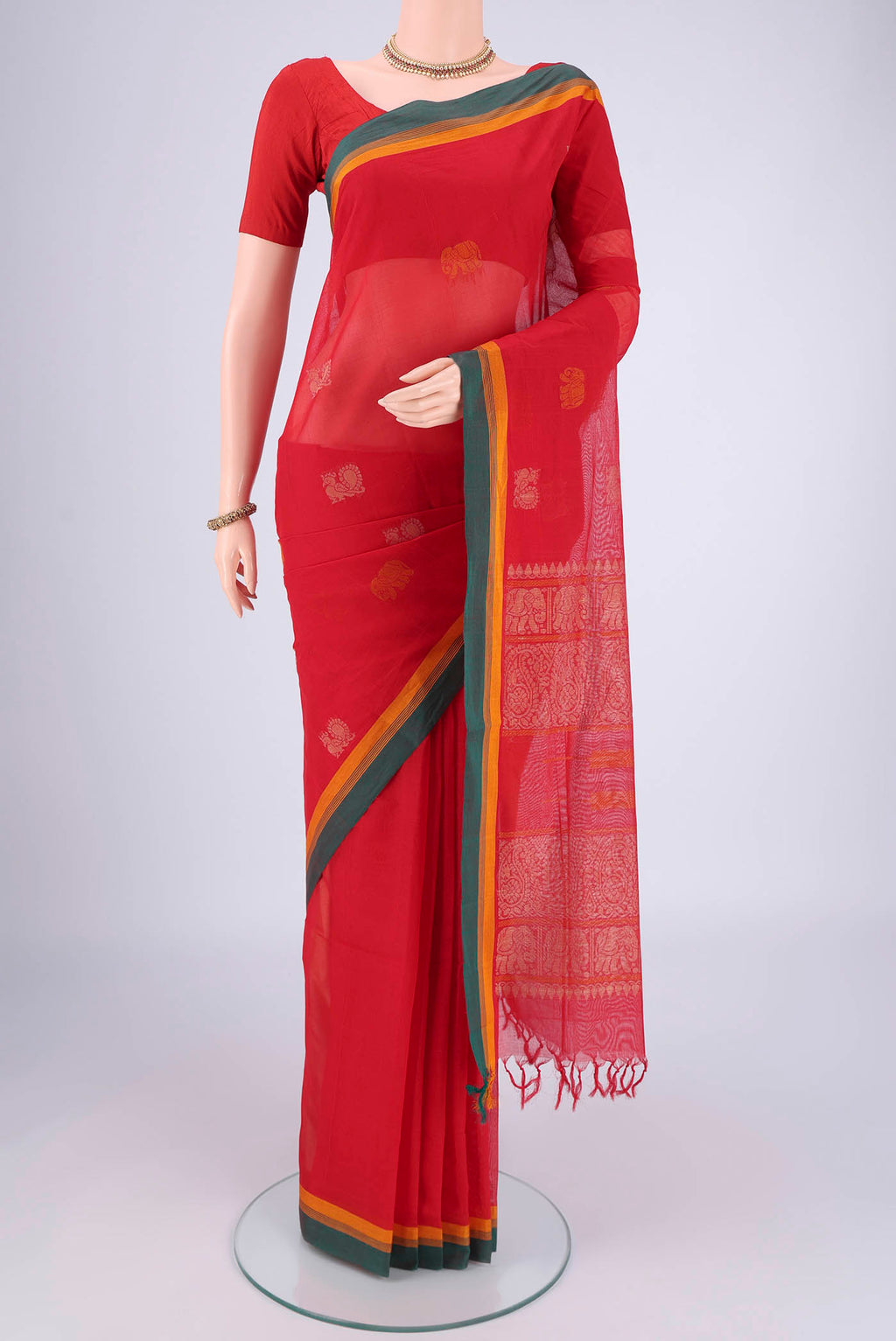 Red Coimbatore Cotton Saree with Thread Butta on the body and Plain Border.  displayed on a mannequin