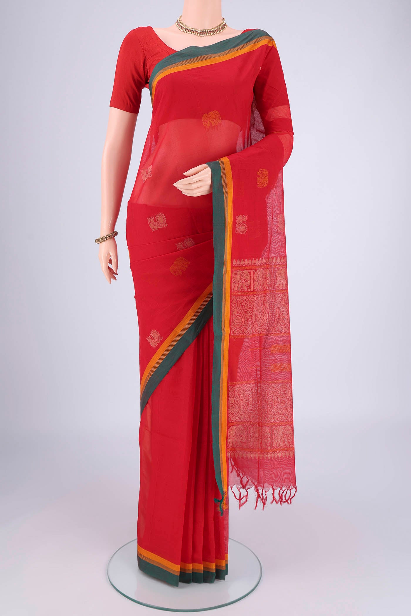 Red Coimbatore Cotton Saree with Thread Butta on the body and Plain Border.  displayed on a mannequin