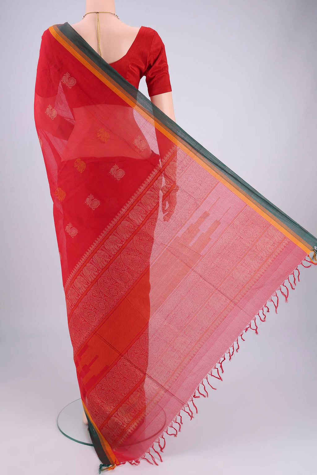 Flat view of Red Coimbatore Cotton Saree with Thread Butta on the body and Plain Border. 