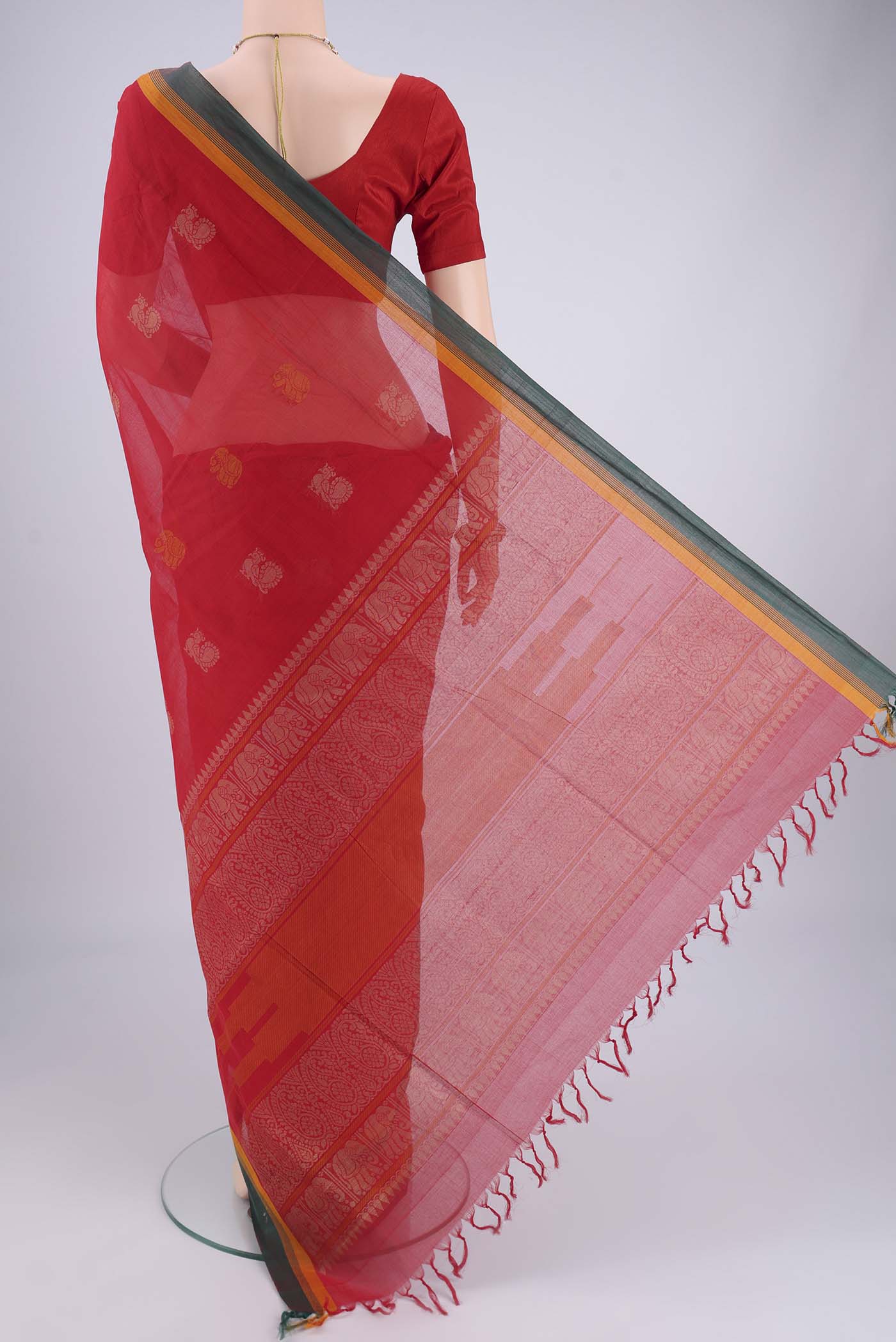 Flat view of Red Coimbatore Cotton Saree with Thread Butta on the body and Plain Border. 