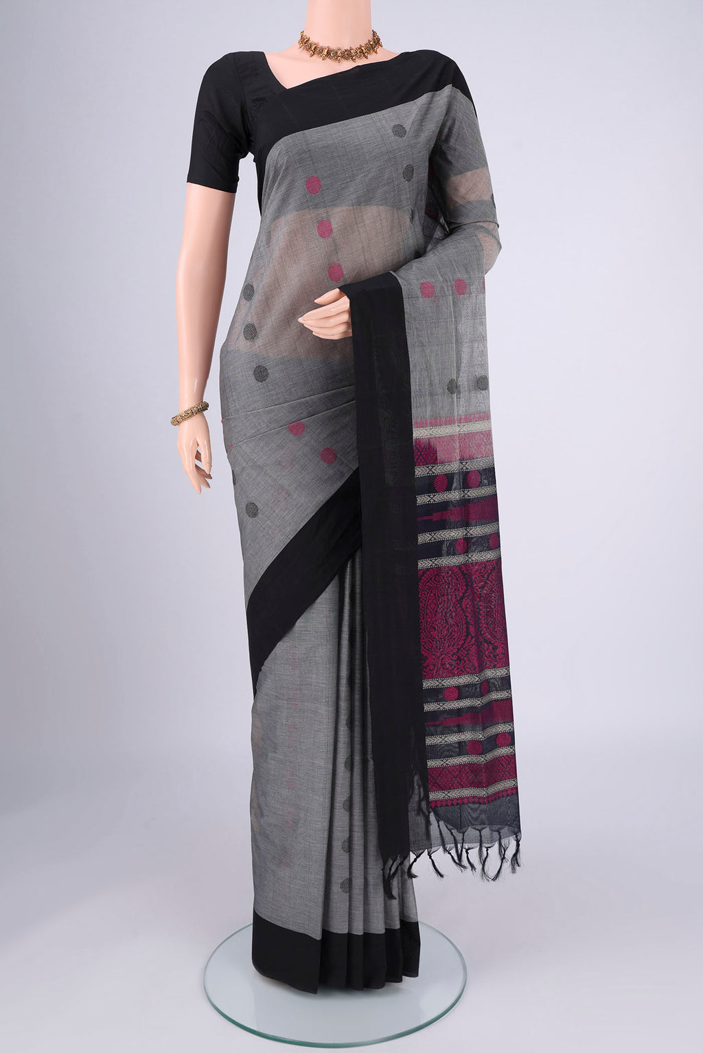 Grey Coimbatore Cotton Saree with Thread Butta on the body and Plain Border.  displayed on a mannequin