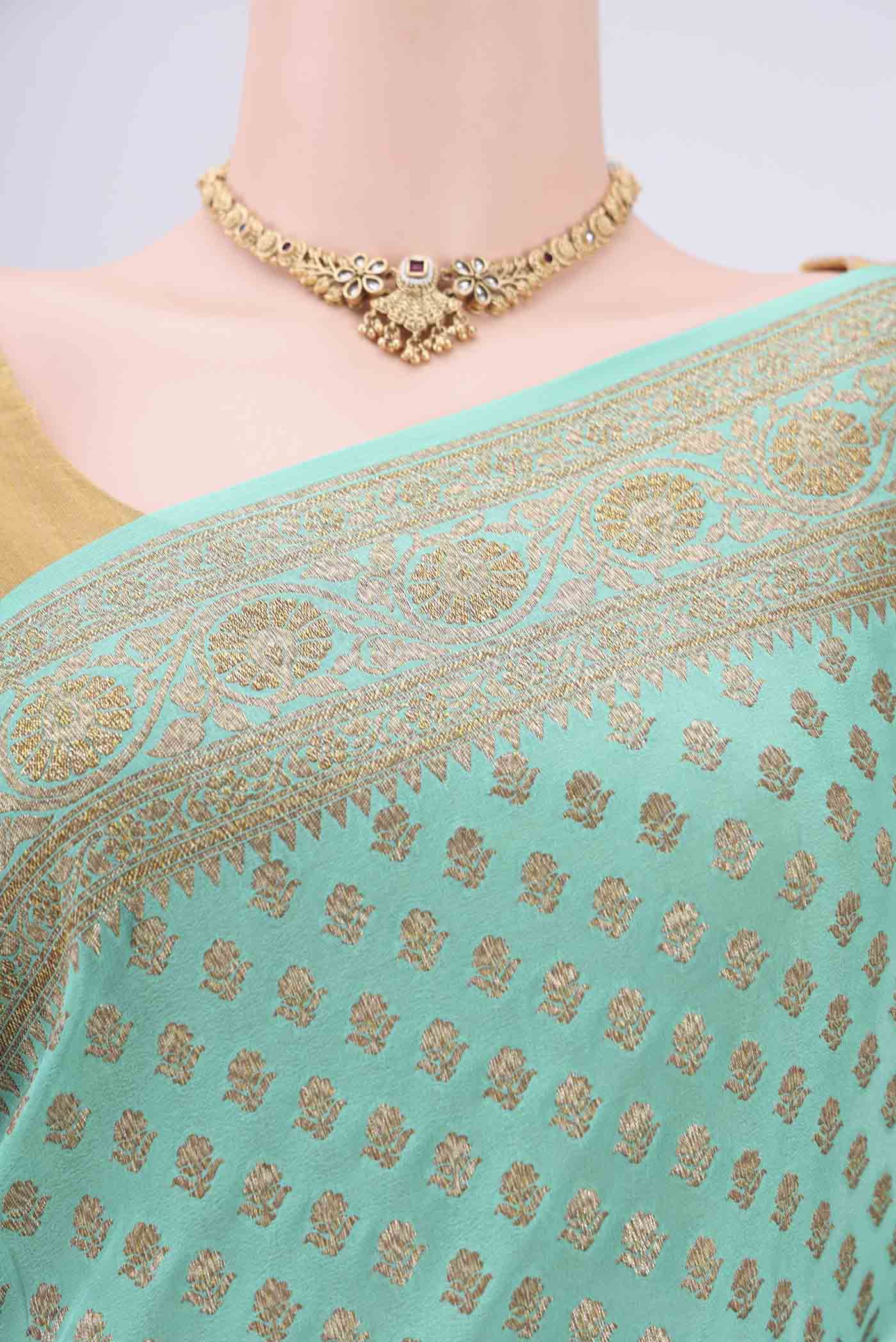 Border image of Sea Green Banarasi Georgette Saree with Zari Brocade on the body and Zari Border. 
