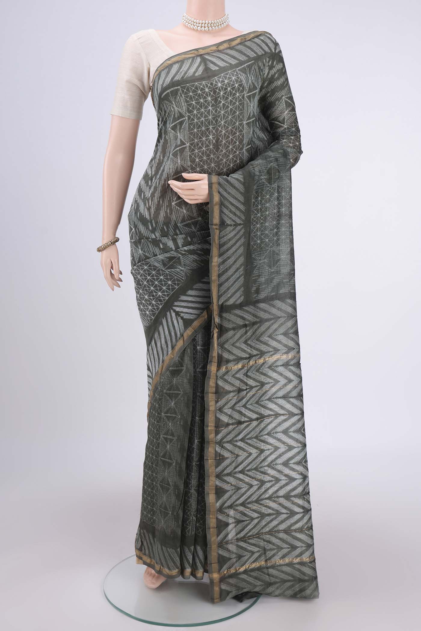 Sage Green Dual Tone Chanderi Silk Saree with Printed design on the body and Thin Zari Line.  displayed on a mannequin
