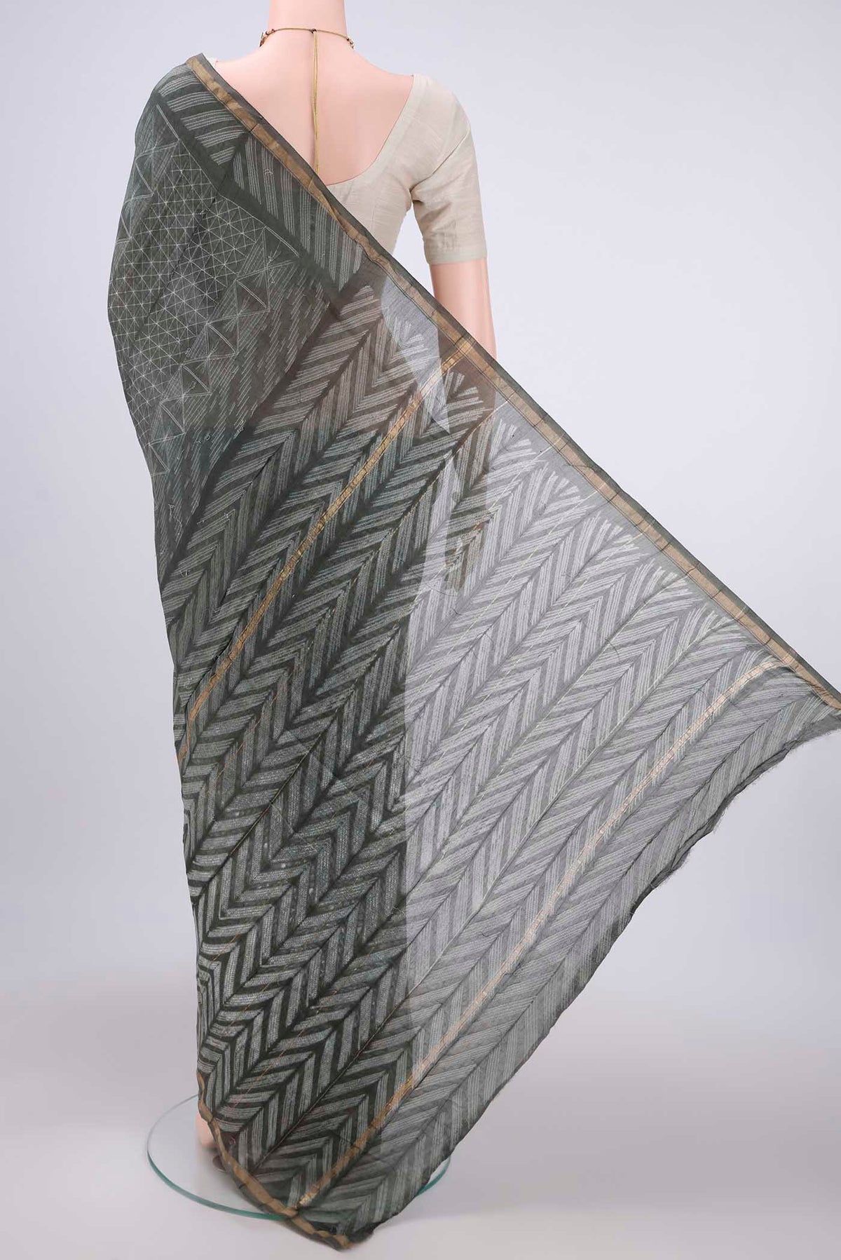 Flat view of Sage Green Dual Tone Chanderi Silk Saree with Printed design on the body and Thin Zari Line. 