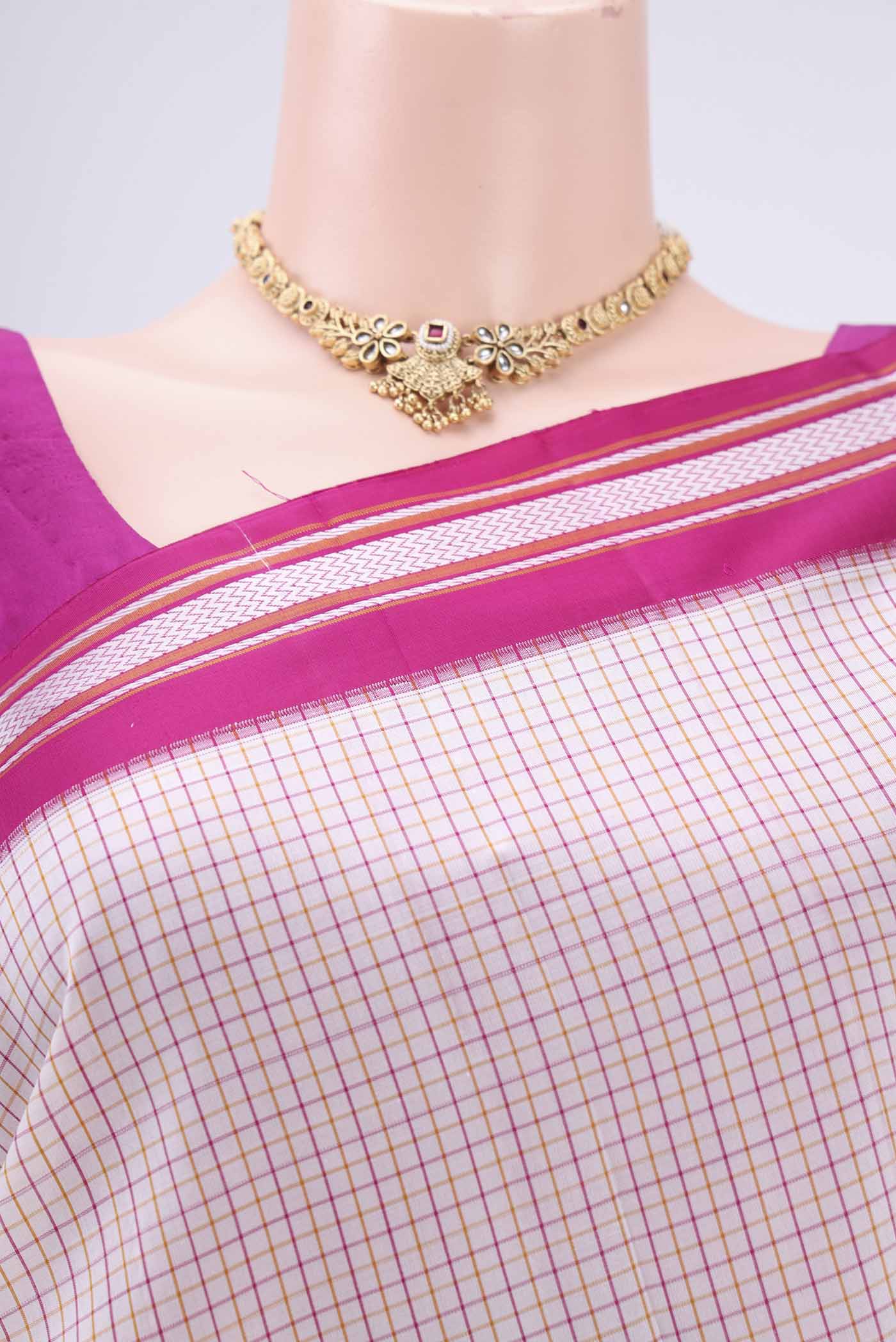 Border image of Off White Dual Tone Kanjivaram Silk Saree with Checked design on the body and Thread Border. 