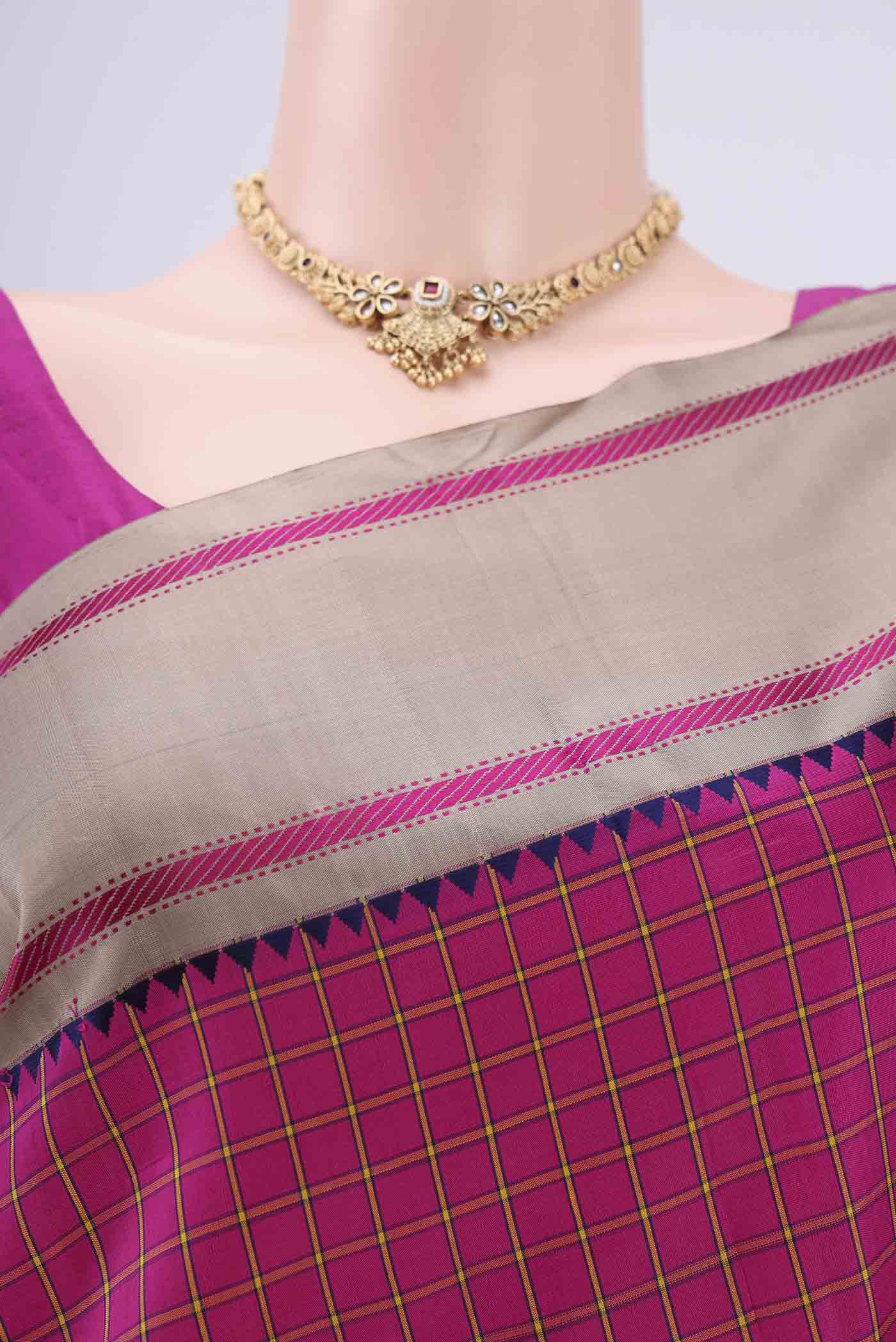Border image of Rani Pink Dual Tone Kanjivaram Silk Saree with Checked design on the body and Zari Border. 