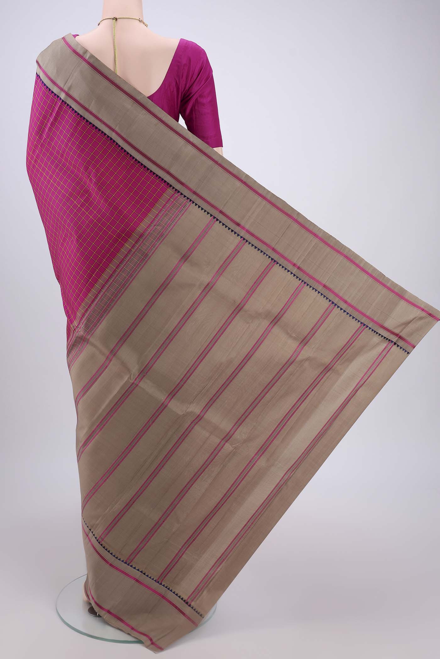 Flat view of Rani Pink Dual Tone Kanjivaram Silk Saree with Checked design on the body and Zari Border. 