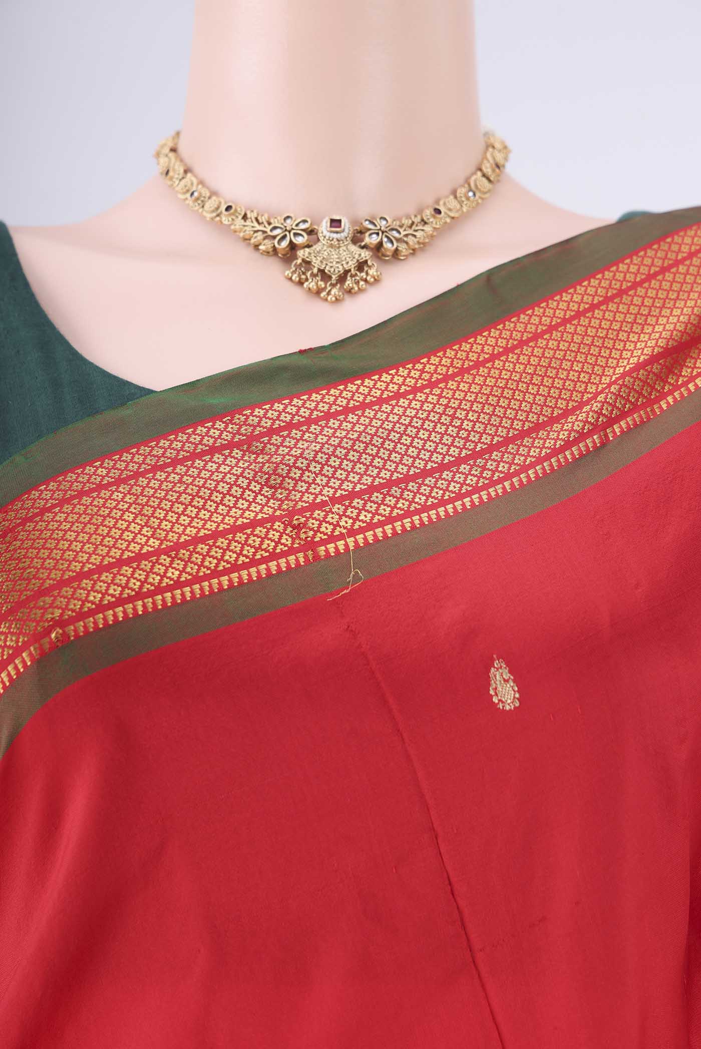 Border image of Maroon Paithani Silk Saree with Zari Butta on the body and Zari Border. 