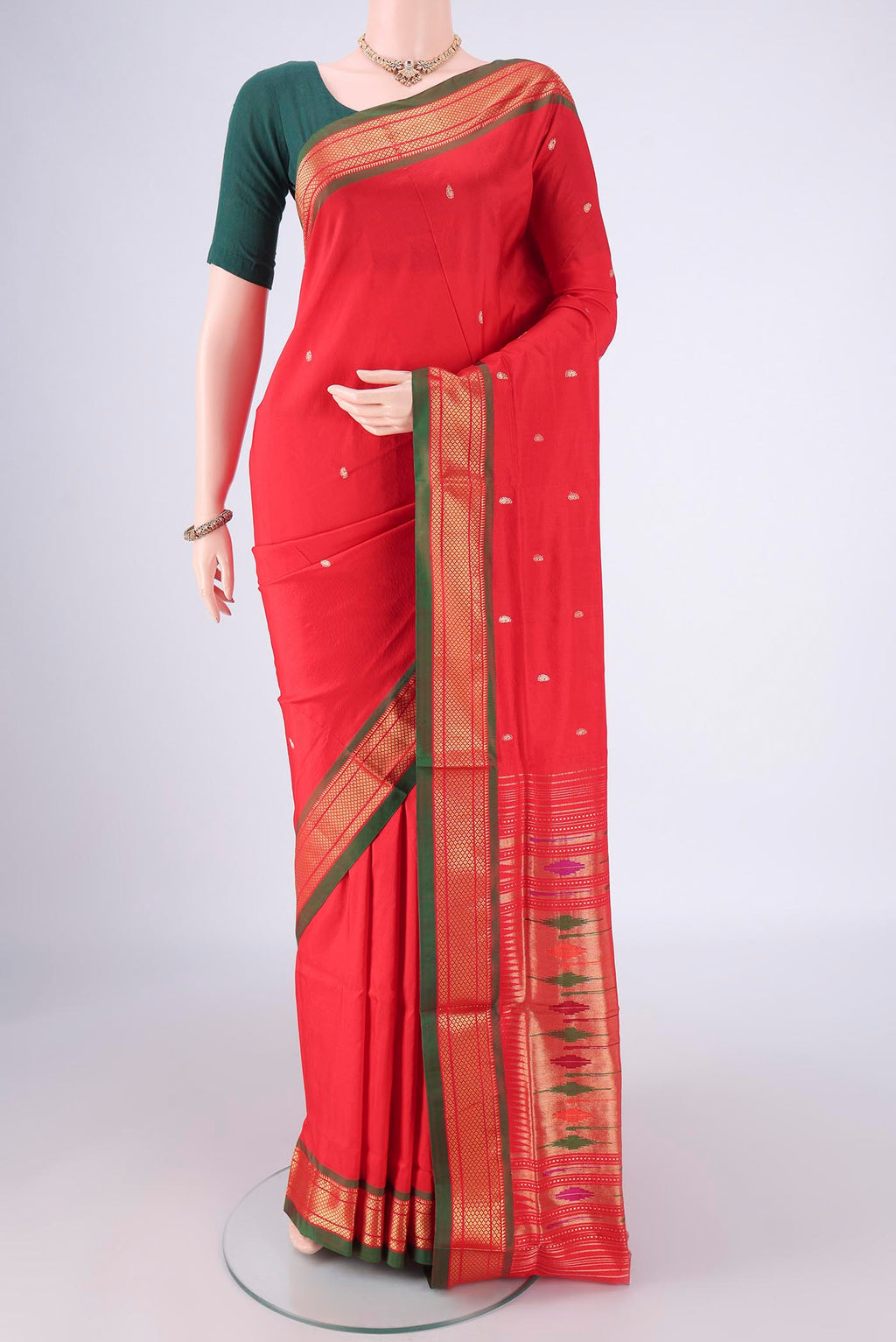 Maroon Paithani Silk Saree with Zari Butta on the body and Zari Border.  displayed on a mannequin