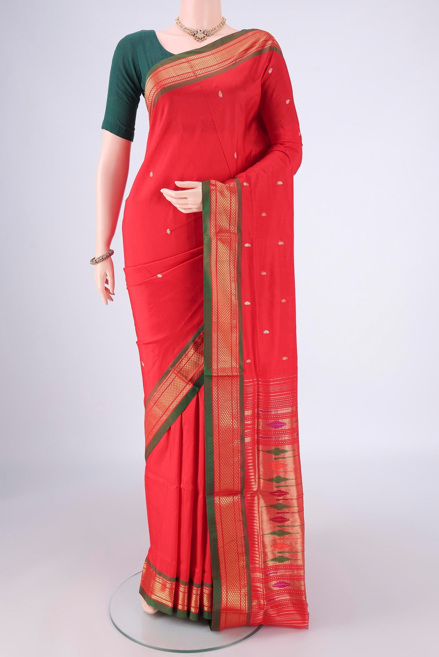 Maroon Paithani Silk Saree with Zari Butta on the body and Zari Border.  displayed on a mannequin