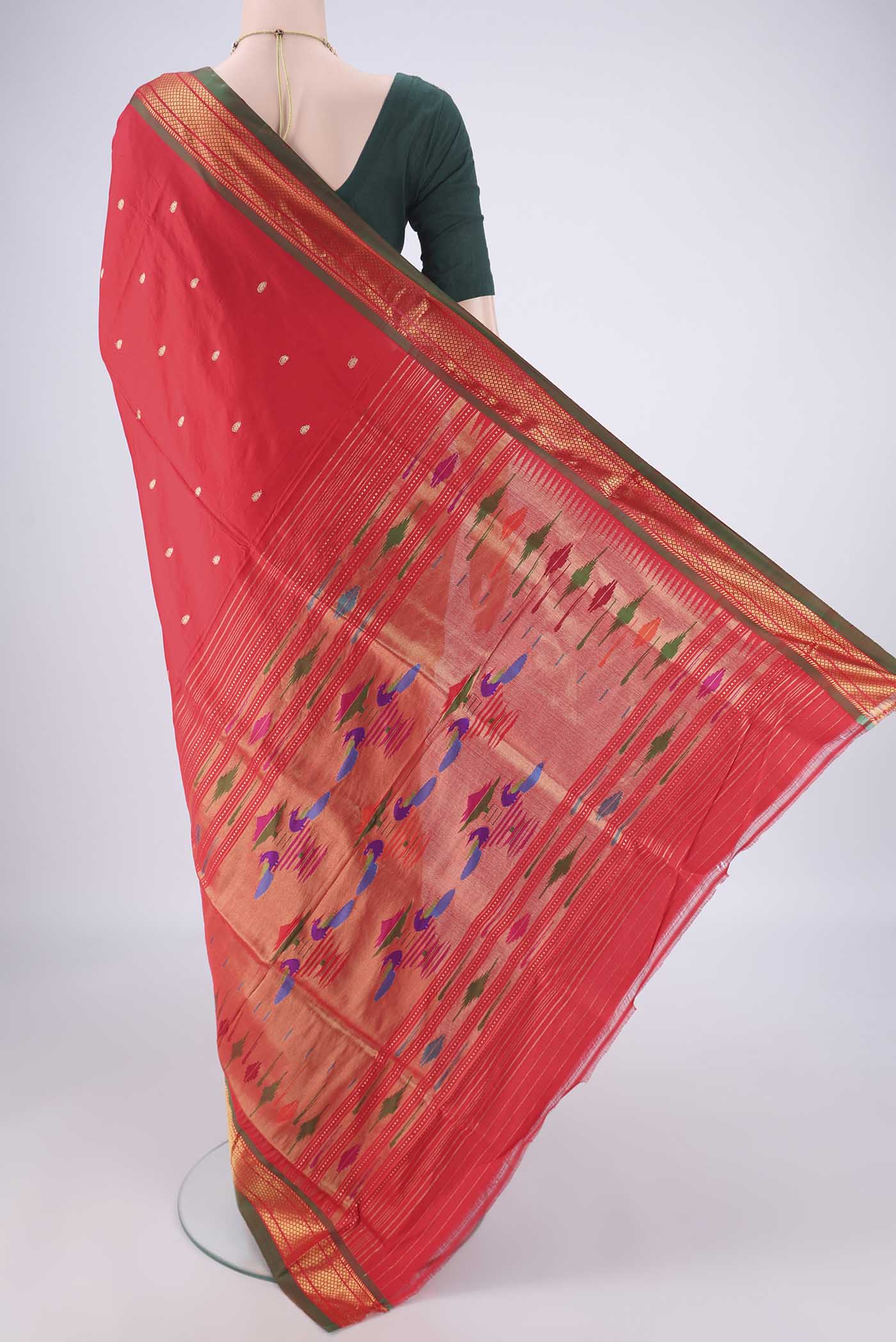 Flat view of Maroon Paithani Silk Saree with Zari Butta on the body and Zari Border. 