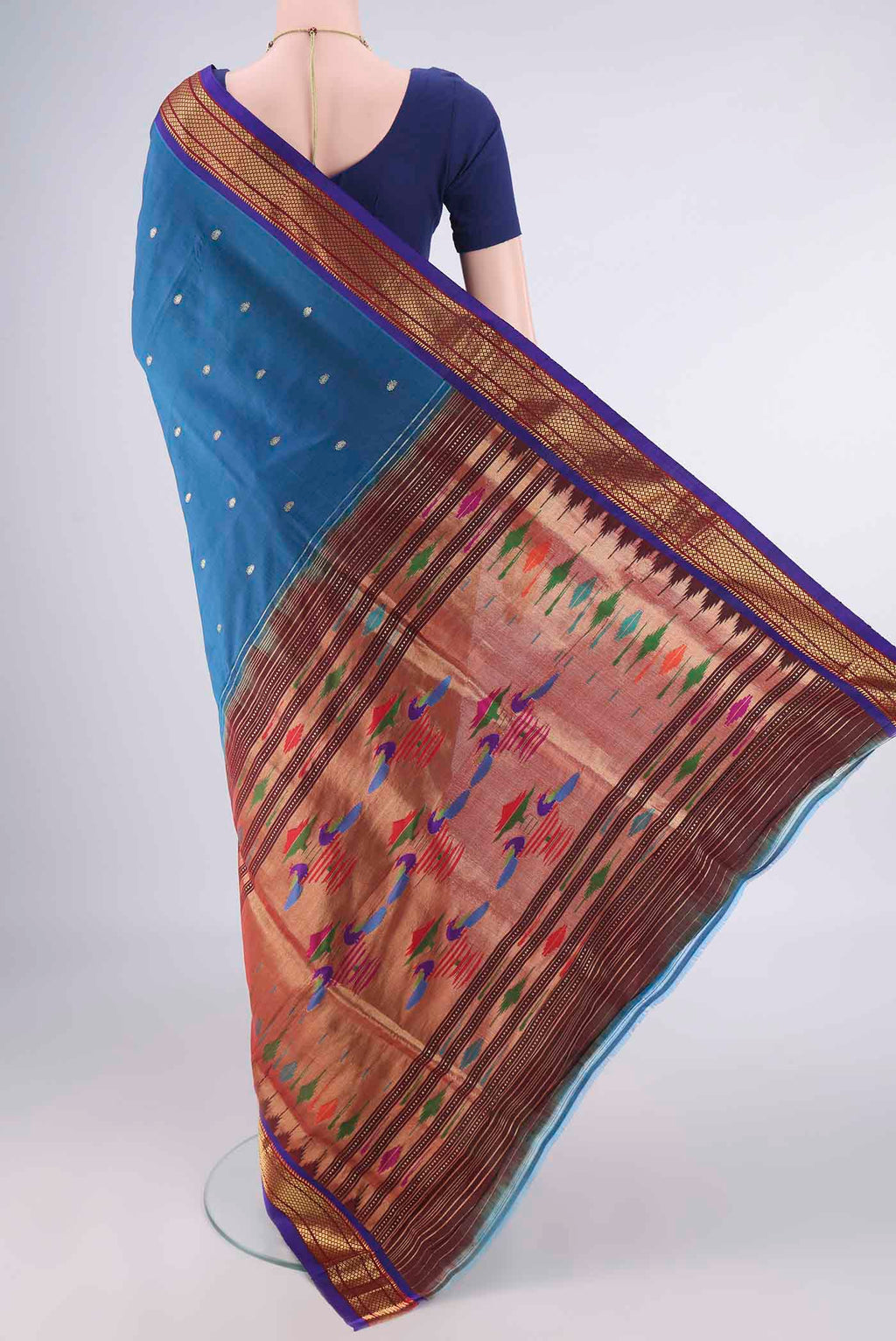 Flat view of Pure Silk Peacock Blue Paithani Saree with Zari Butta on the body and Zari Border. 