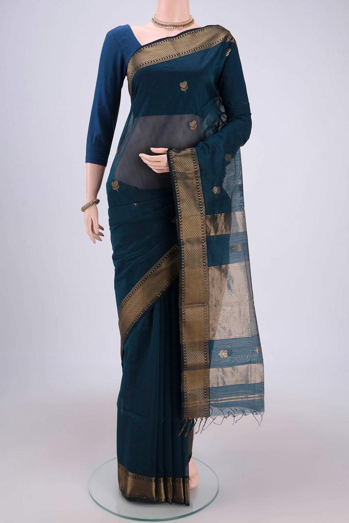 Dark Blue Maheshwari Silk Cotton Saree with Plain Body and Zari Border.  displayed on a mannequin