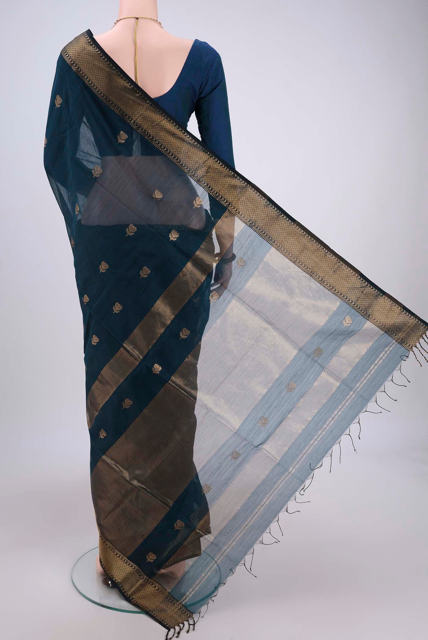 Flat view of Dark Blue Maheshwari Silk Cotton Saree with Plain Body and Zari Border. 