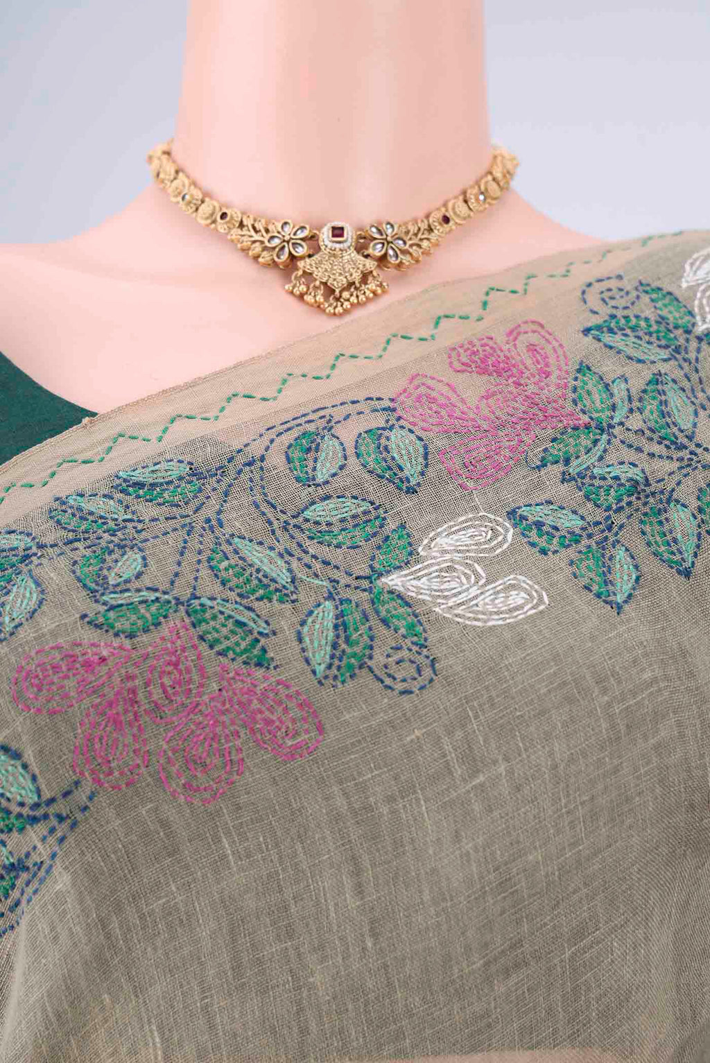 Border image of Sage Green Linen Cotton Saree with Kantha Work on the body and Thread Border. 