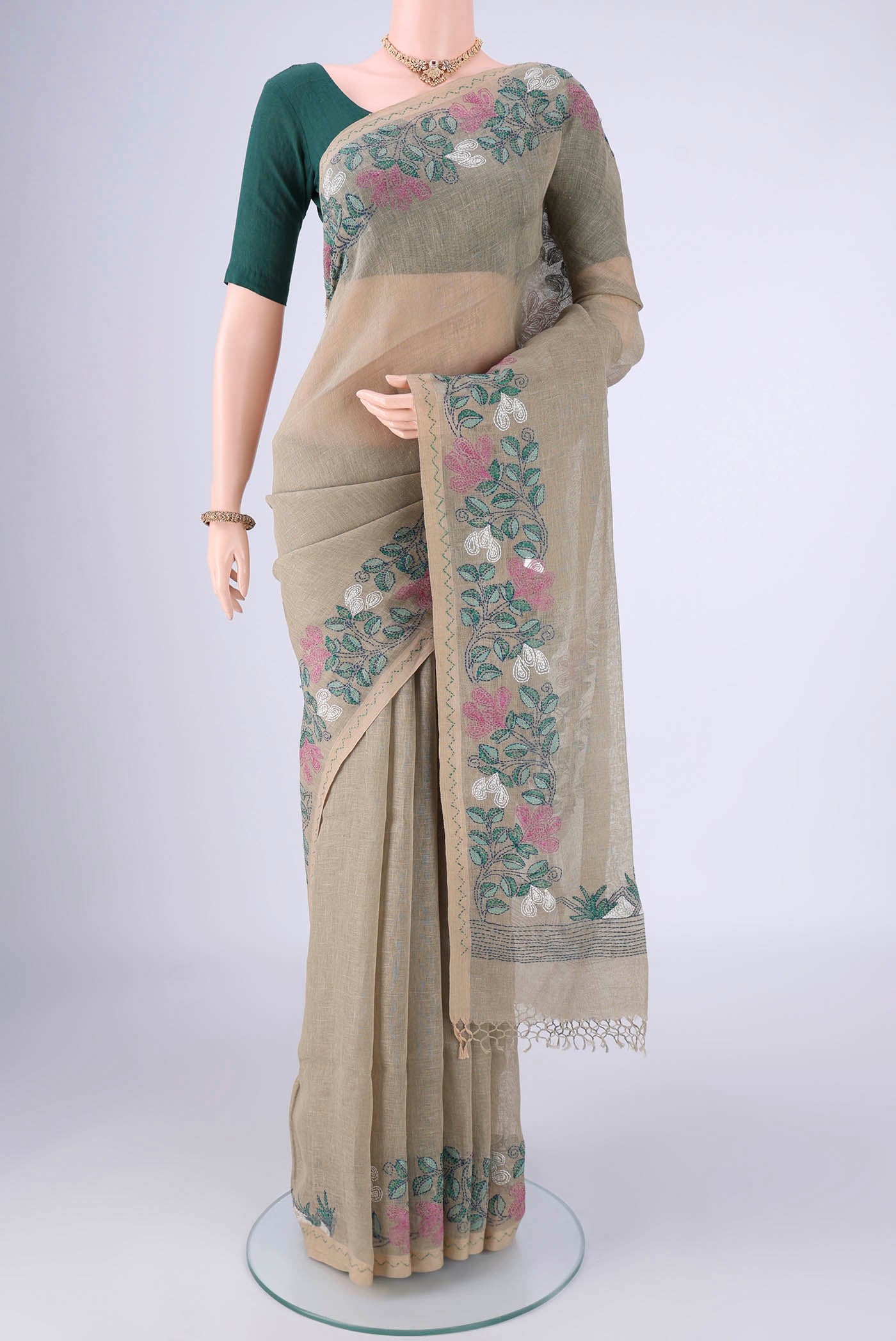 Sage Green Linen Cotton Saree with Kantha Work on the body and Thread Border.  displayed on a mannequin