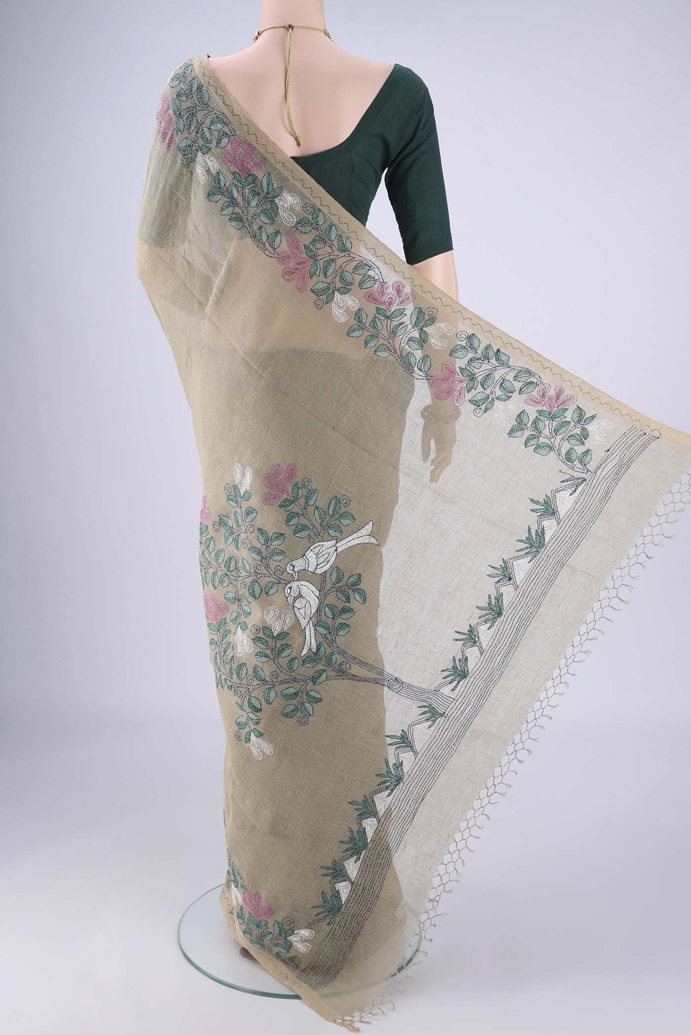 Flat view of Sage Green Linen Cotton Saree with Kantha Work on the body and Thread Border. 