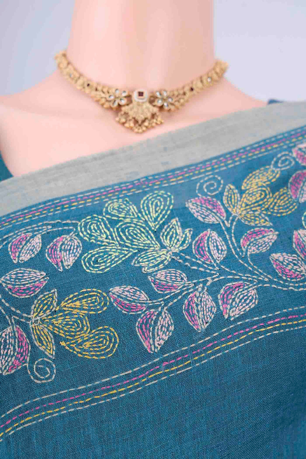 Border image of Blue Linen Cotton Saree with Kantha Work on the body and Thread Border. 