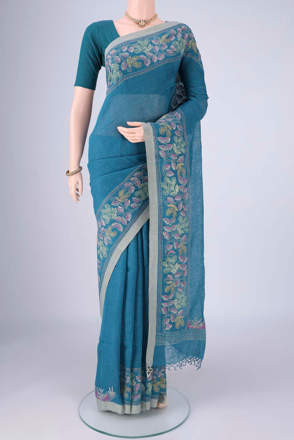 Blue Linen Cotton Saree with Kantha Work on the body and Thread Border.  displayed on a mannequin