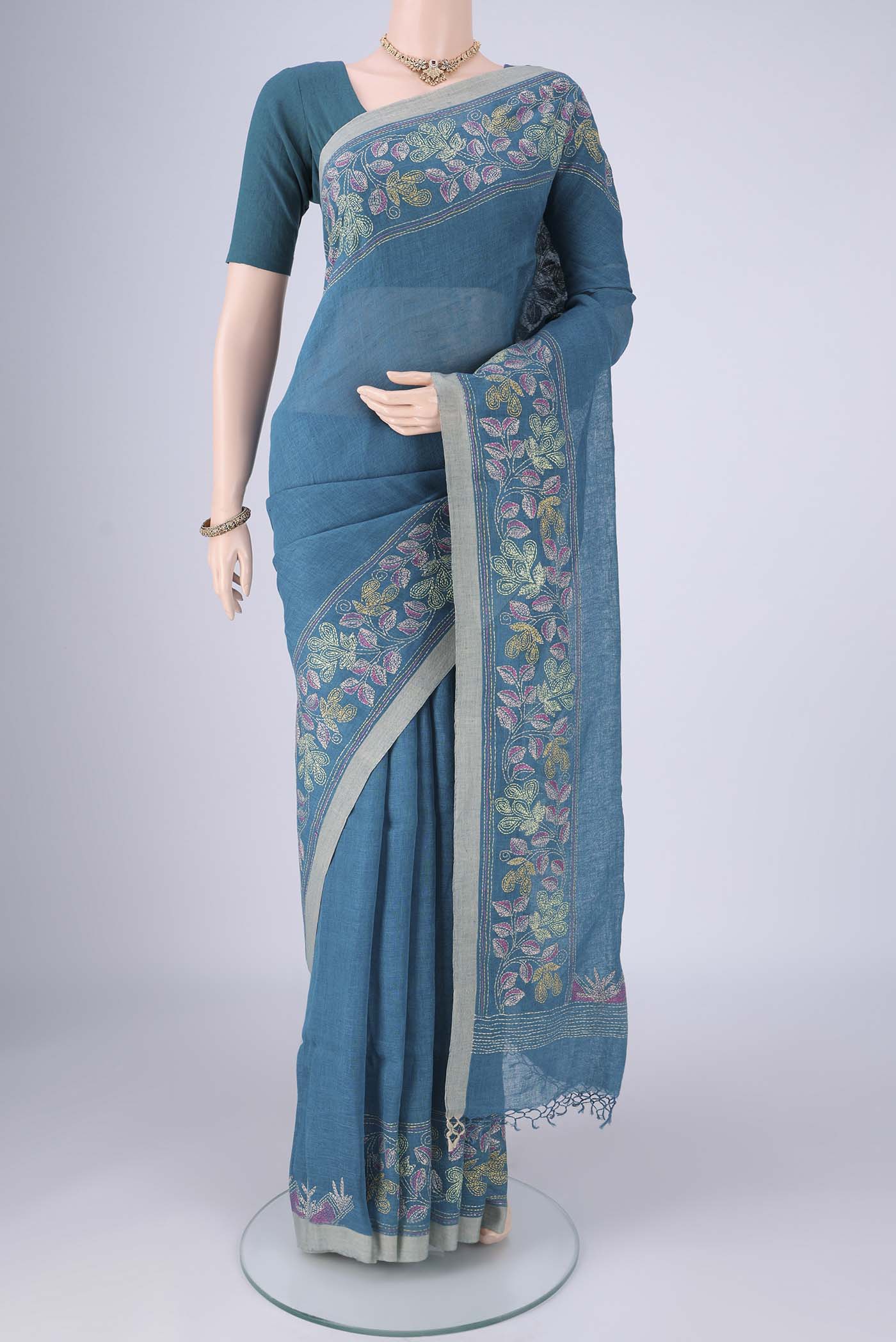 Blue Linen Cotton Saree with Kantha Work on the body and Thread Border.  displayed on a mannequin