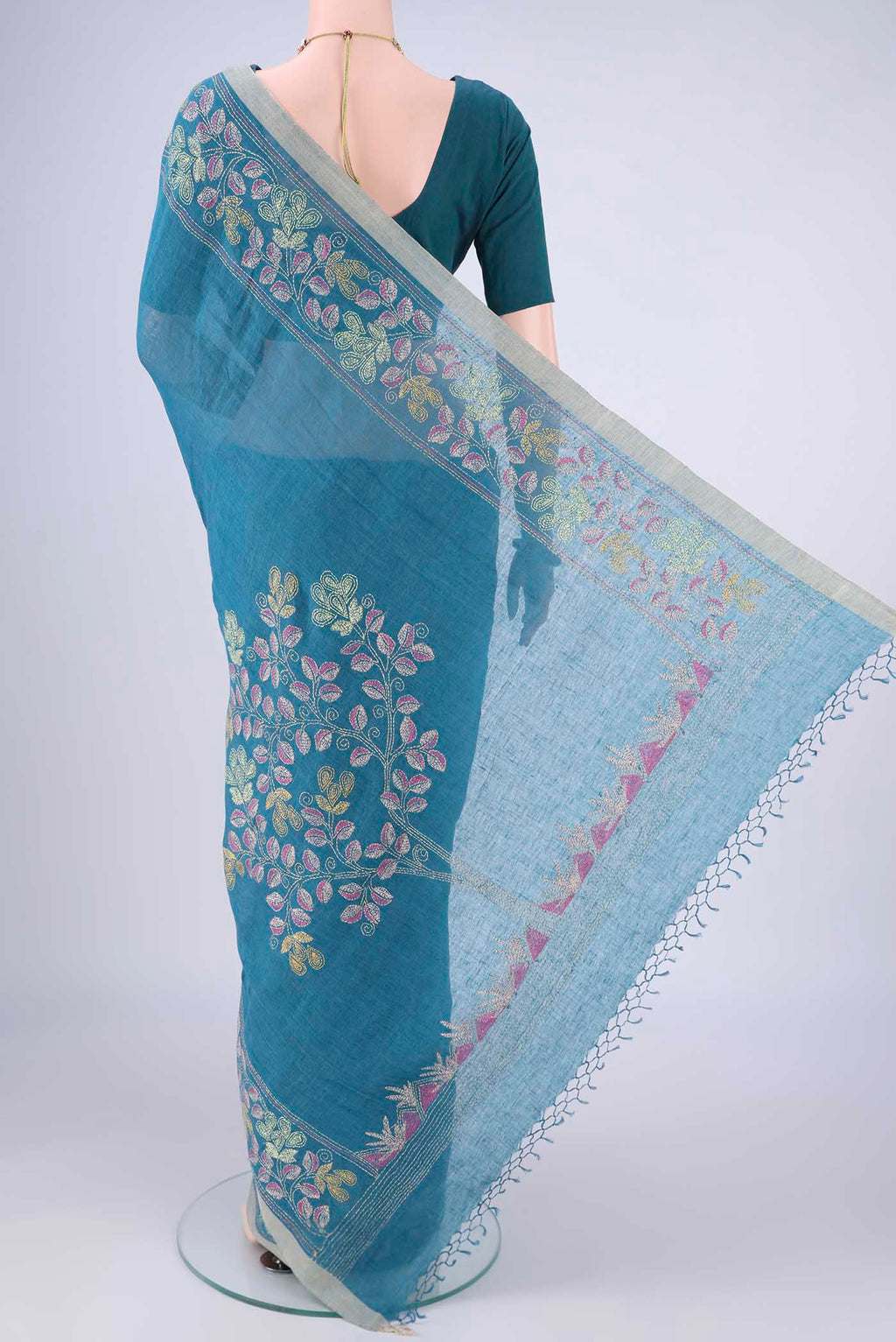 Flat view of Blue Linen Cotton Saree with Kantha Work on the body and Thread Border. 