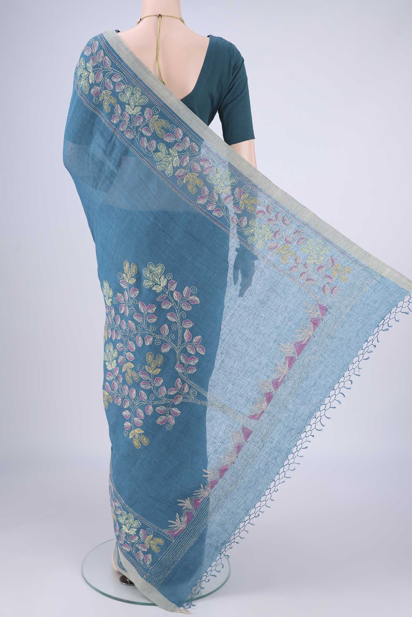 Flat view of Blue Linen Cotton Saree with Kantha Work on the body and Thread Border. 