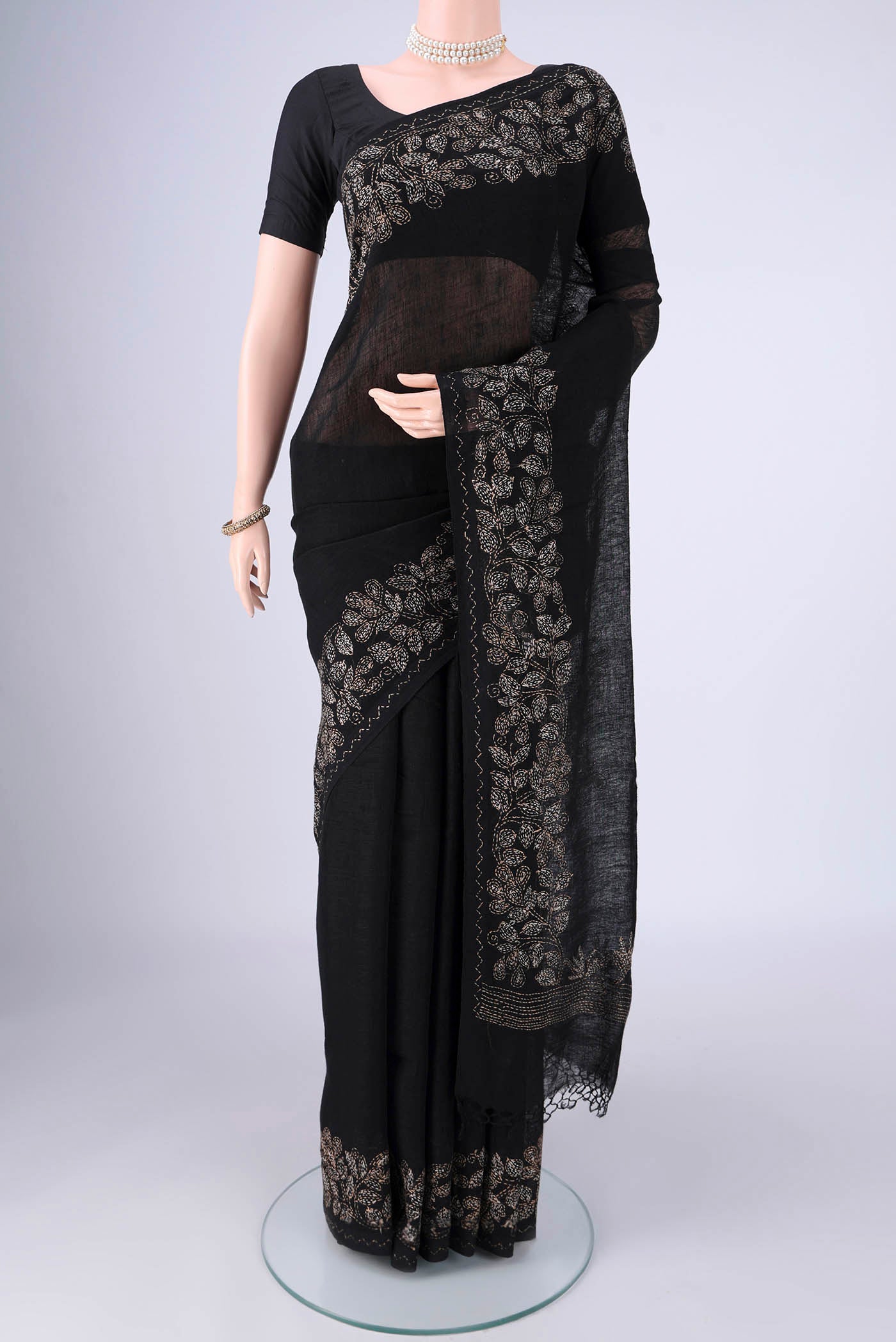 Black Linen Cotton Saree with Kantha Work on the body and Thread Border.  displayed on a mannequin
