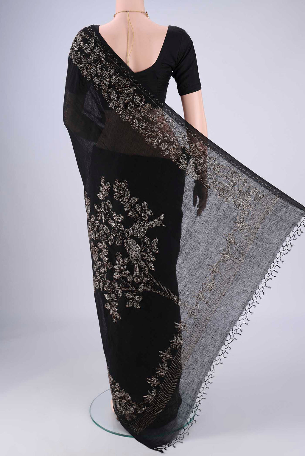 Flat view of Black Linen Cotton Saree with Kantha Work on the body and Thread Border. 
