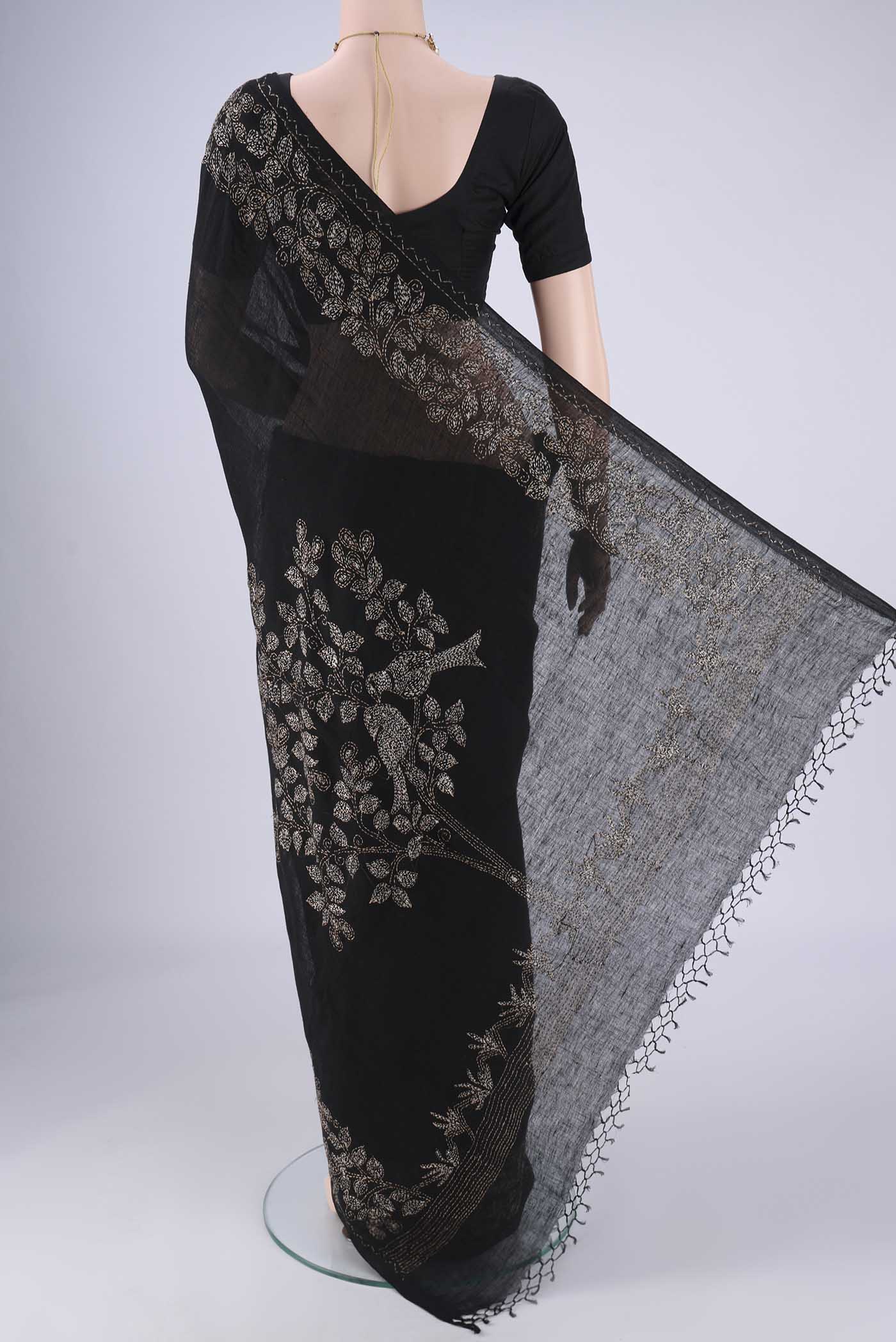 Flat view of Black Linen Cotton Saree with Kantha Work on the body and Thread Border. 