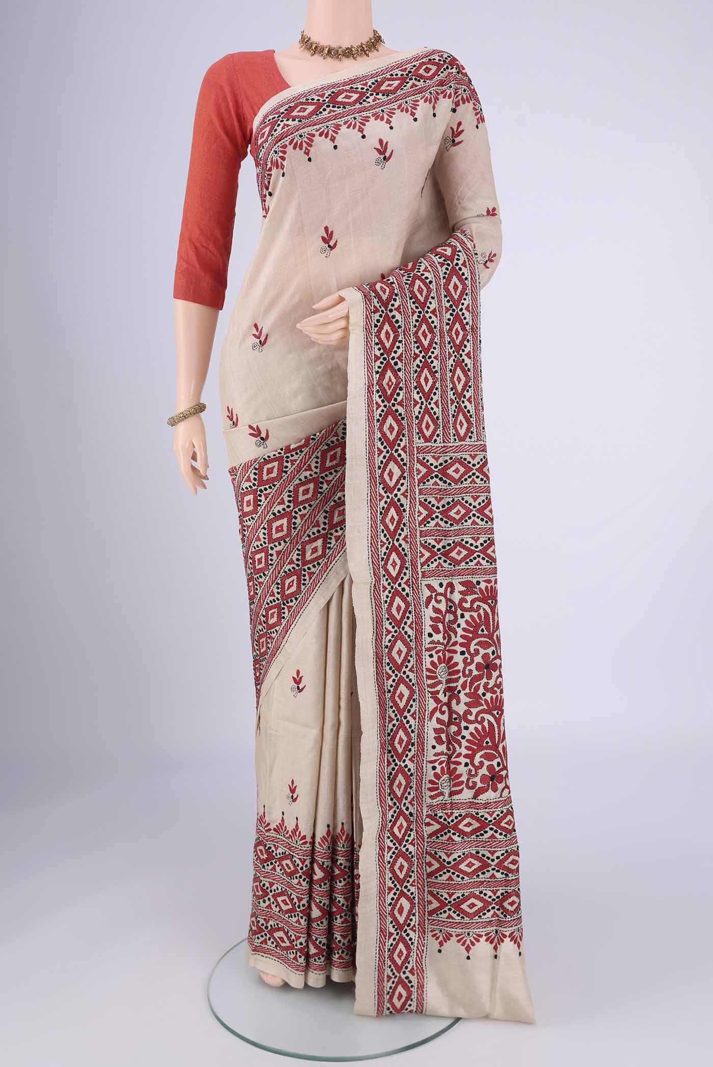 Beige Kantha Silk Saree with Kantha Work on the body and Thread Border.  displayed on a mannequin