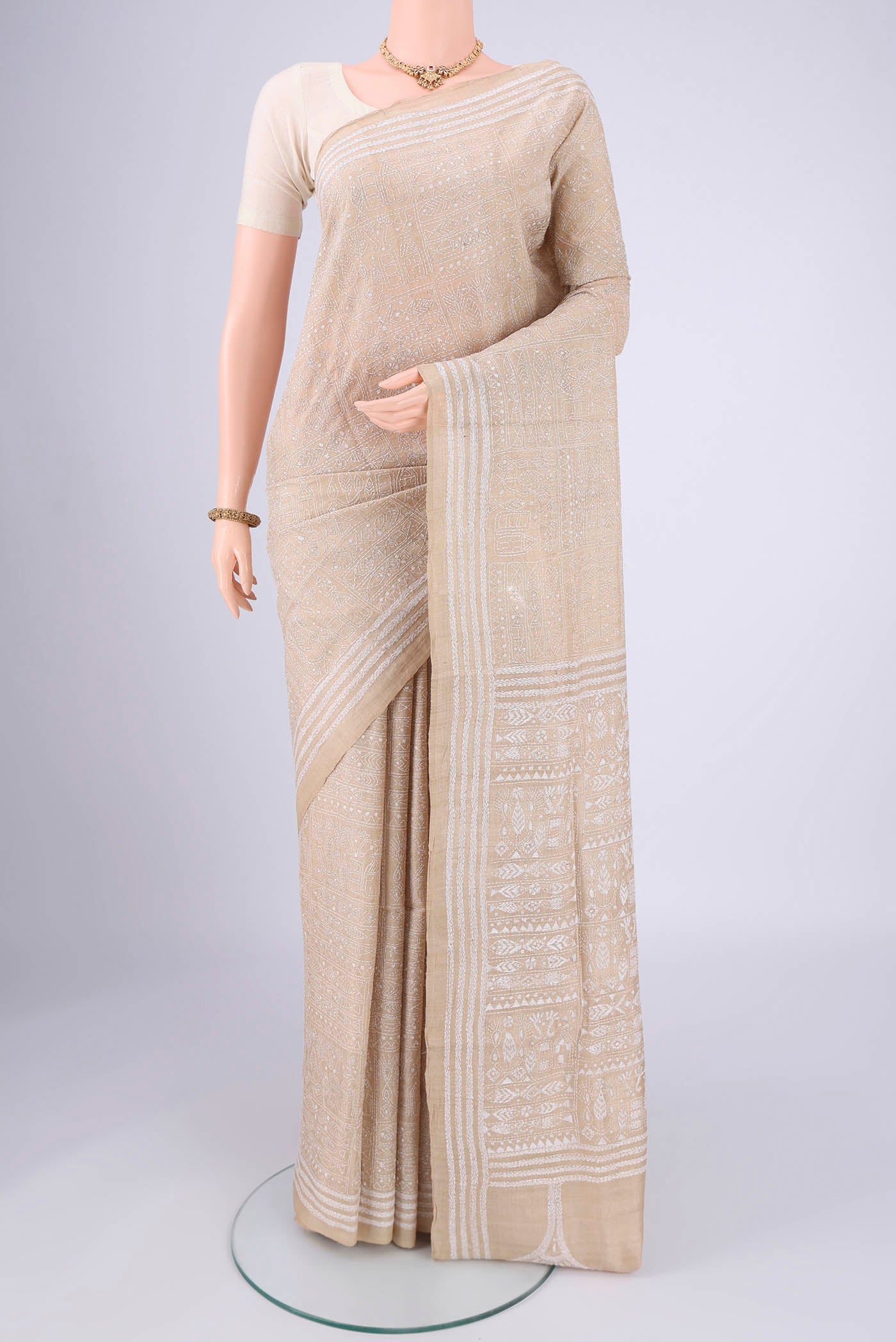 Beige Kantha Silk Saree with Kantha Work on the body and Thread Border.  displayed on a mannequin