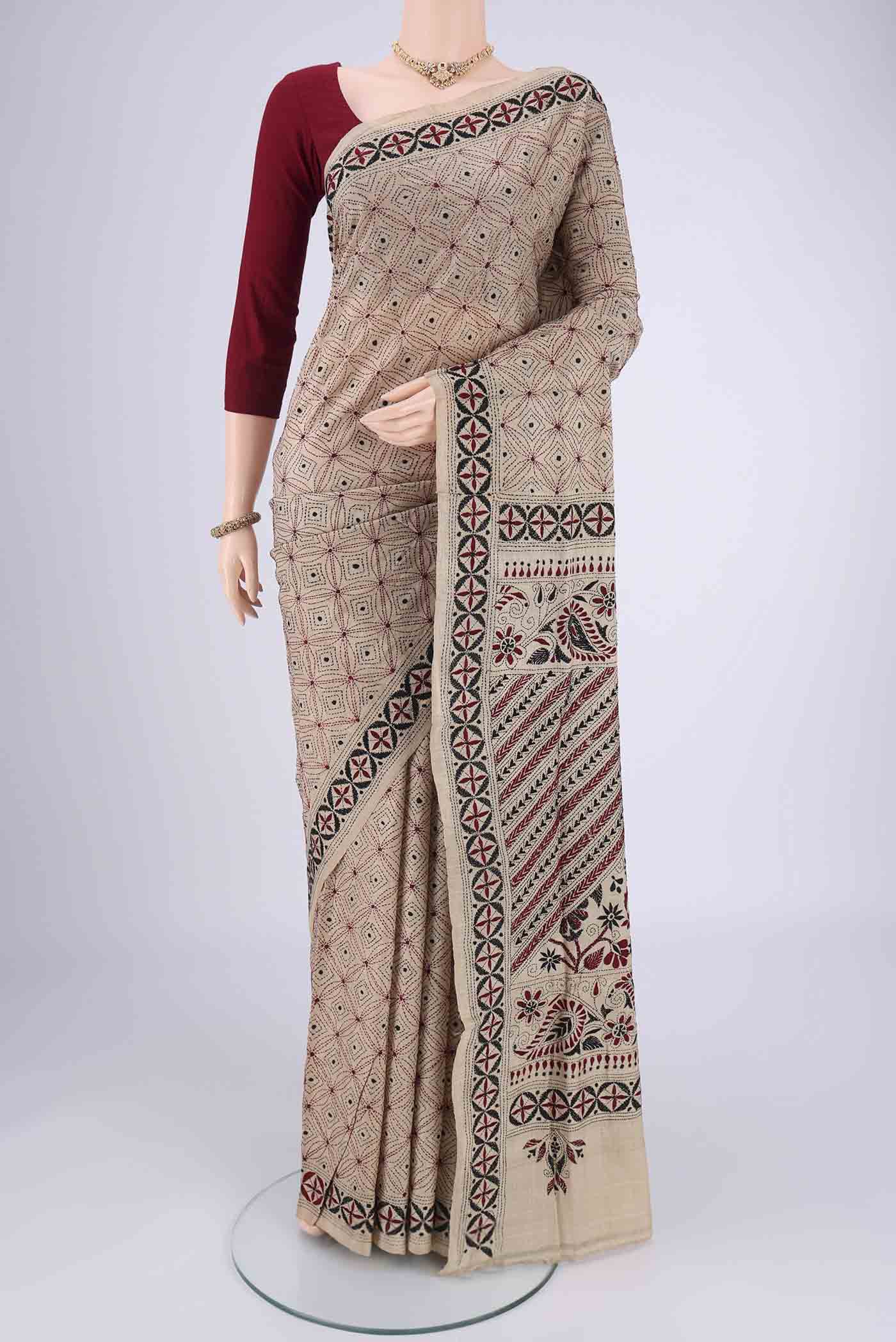 Beige Kantha Silk Saree with Kantha Work on the body and Thread Border.  displayed on a mannequin
