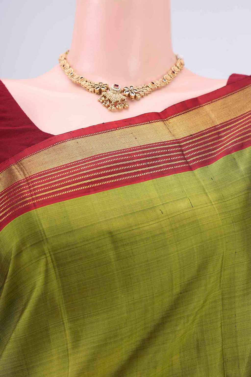Border image of Mehandi Green Kanjivaram Silk Saree with Plain Body and Zari Border. 