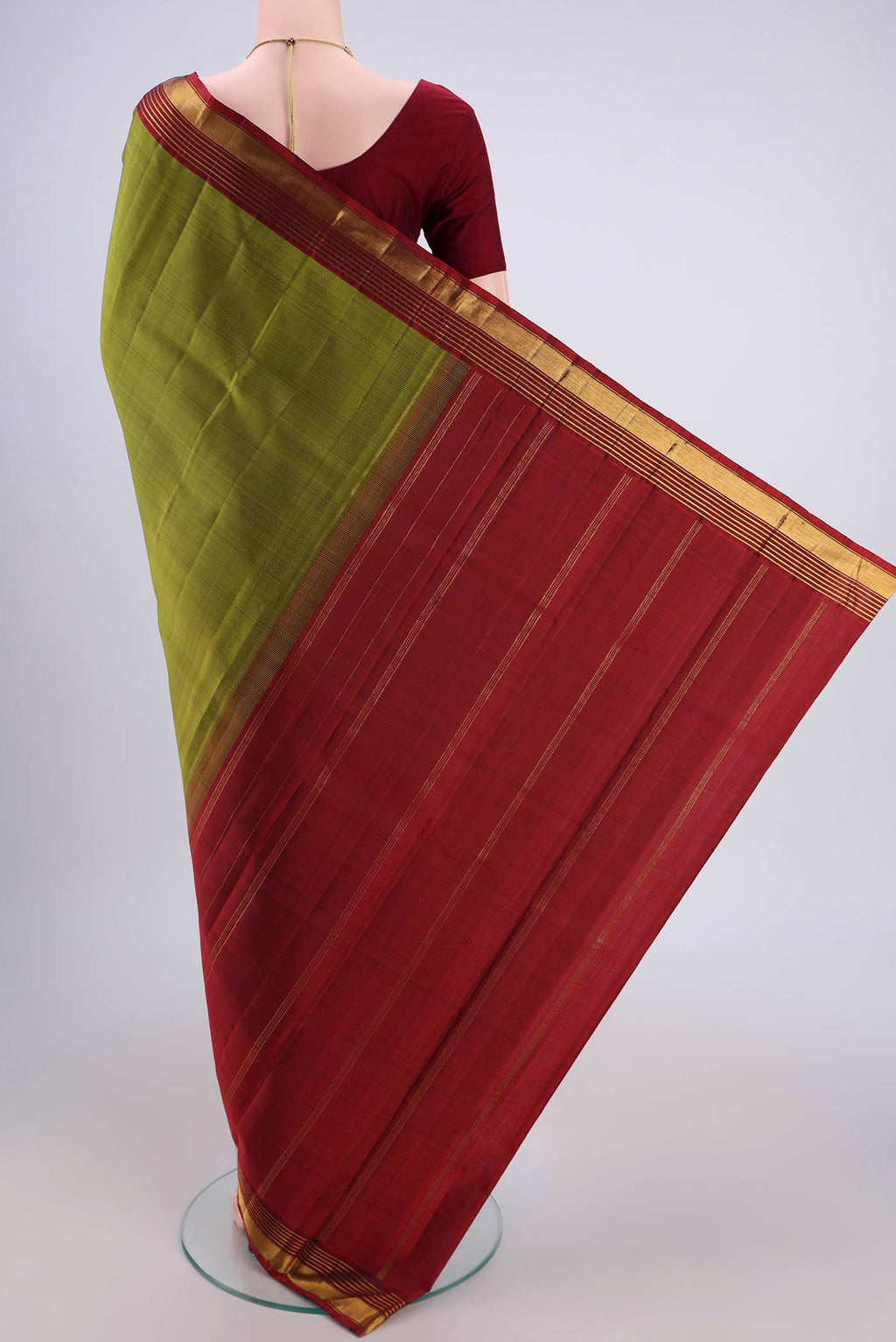 Flat view of Mehandi Green Kanjivaram Silk Saree with Plain Body and Zari Border. 