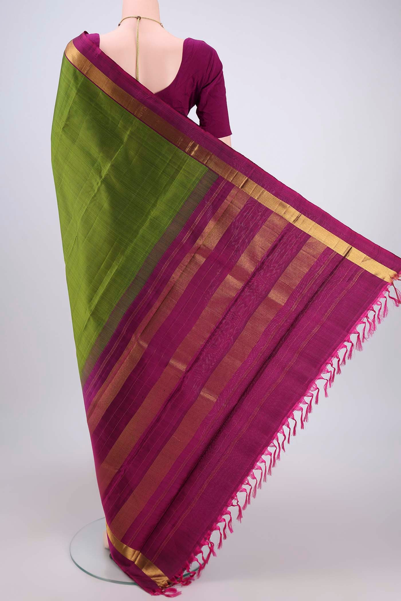 Flat view of Mehandi Green Dual Tone Kanjivaram Silk Saree with Plain Body and Zari Border. 
