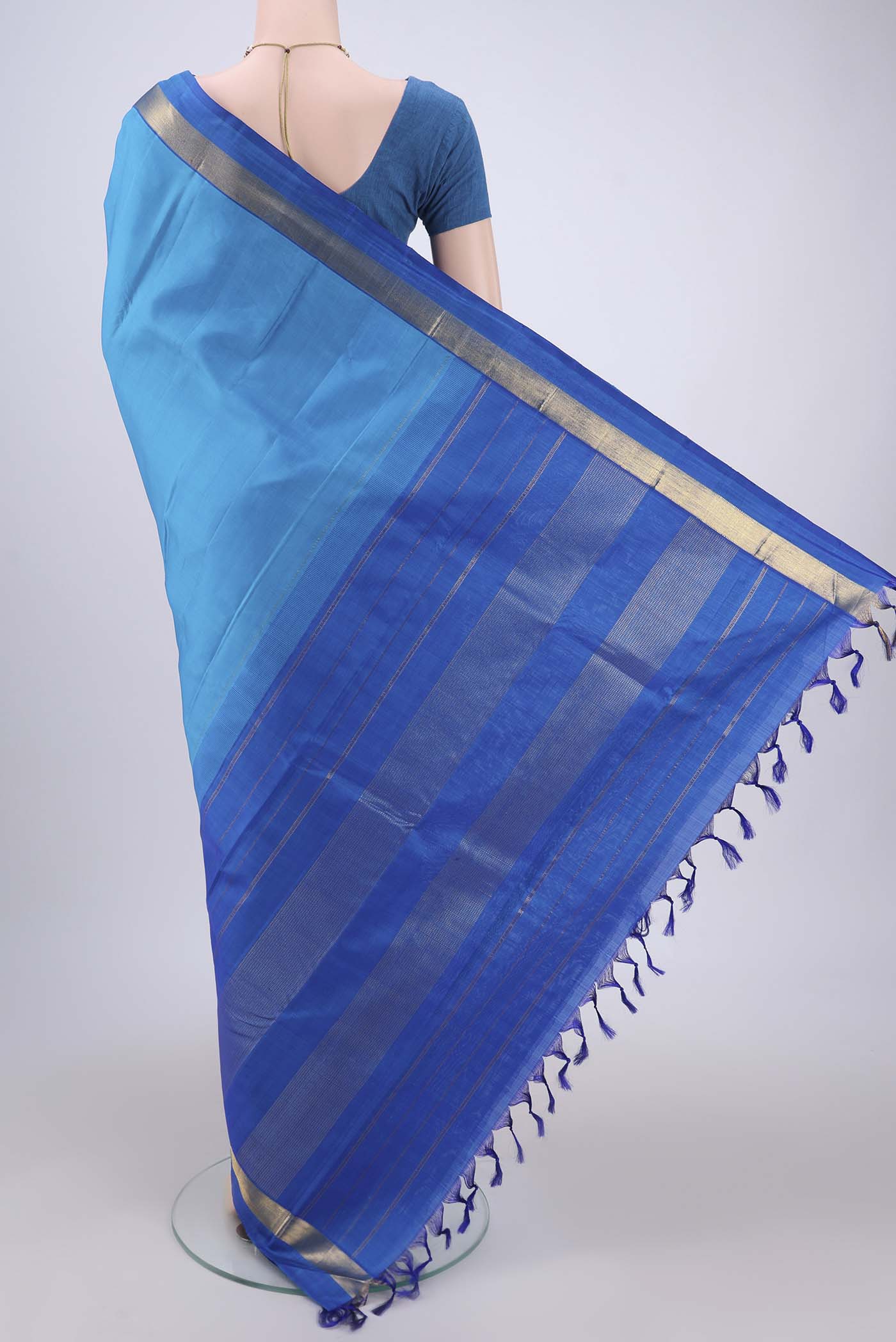 Flat view of Blue Dual Tone Kanjivaram Silk Saree with Plain Body and Zari Border. 
