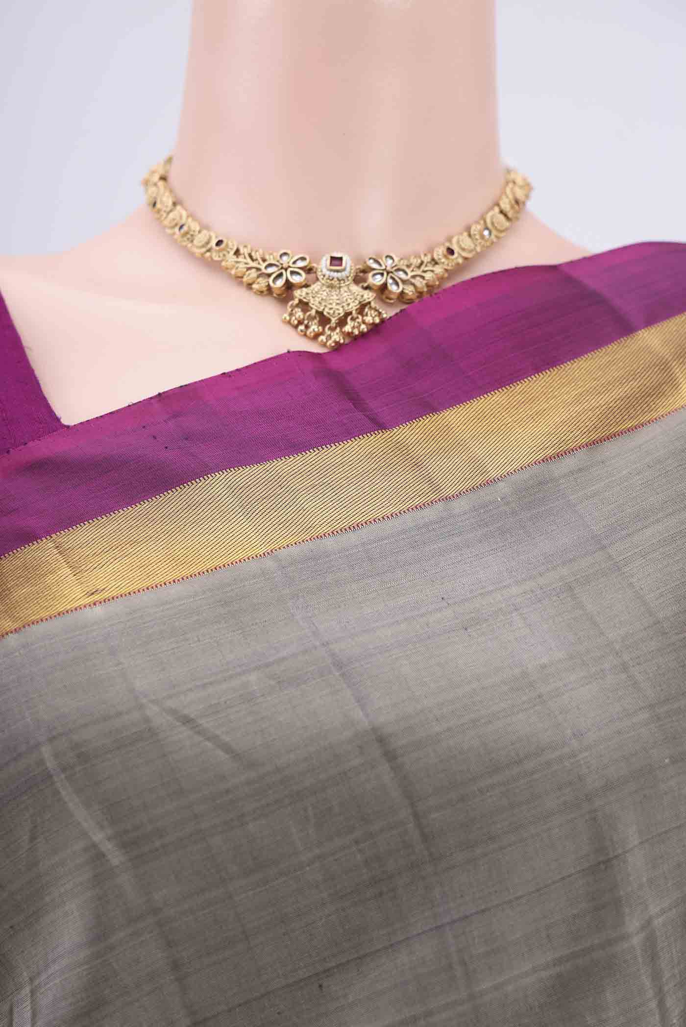 Border image of Grey Kanjivaram Silk Saree with Plain Body and Zari Border. 