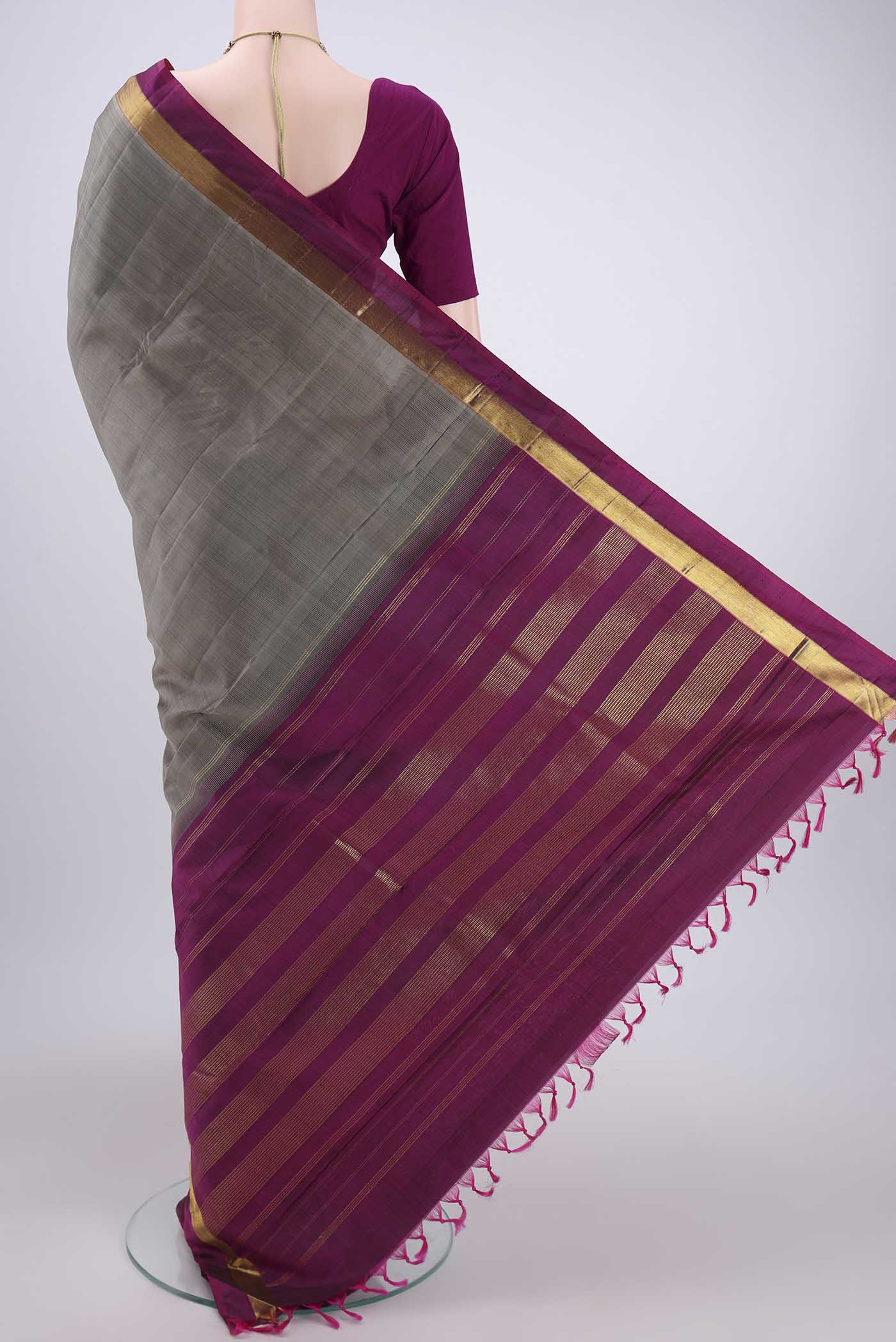 Flat view of Grey Kanjivaram Silk Saree with Plain Body and Zari Border. 