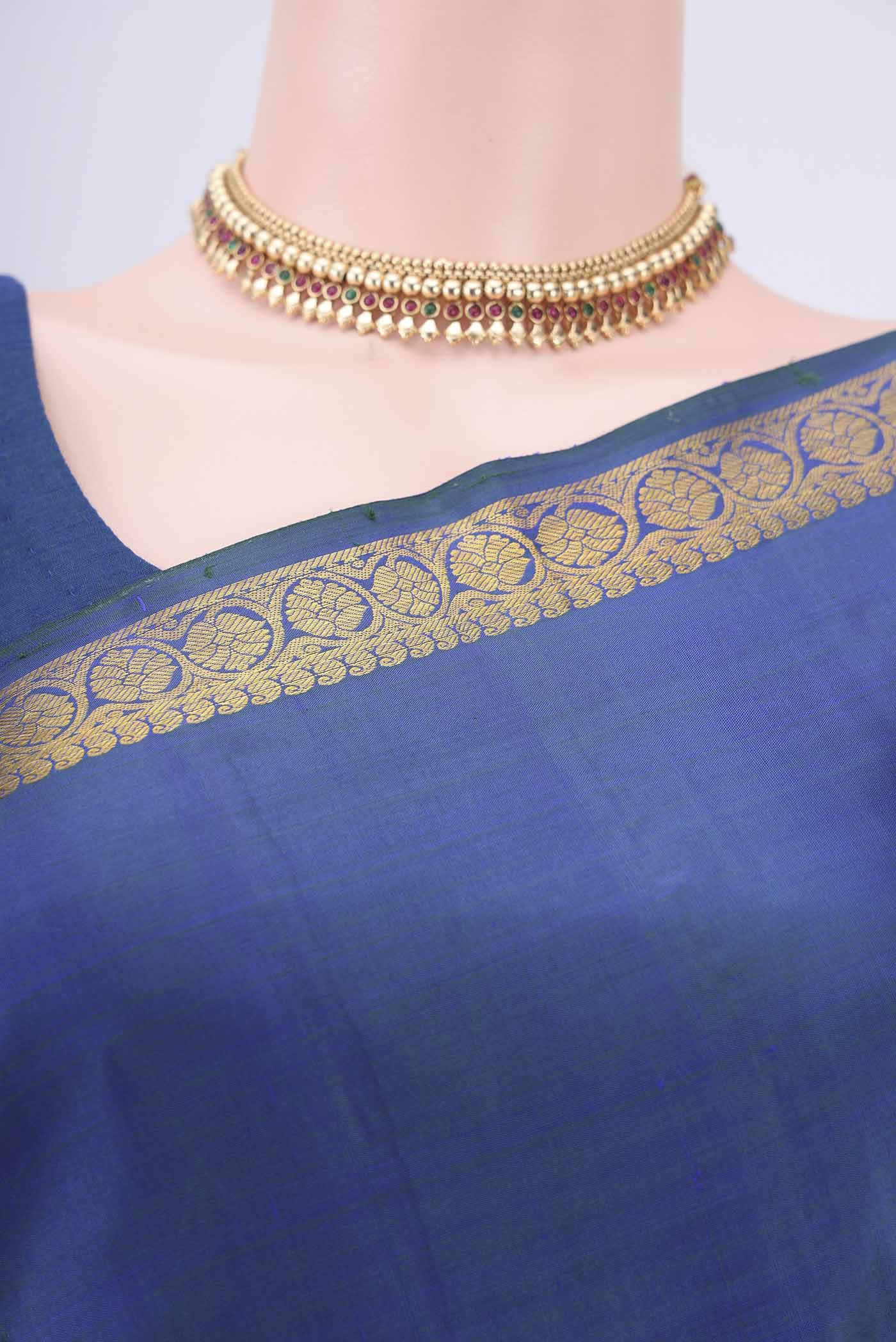 Border image of Peacock Blue Dual Tone Kanjivaram Silk Saree with Plain Body and Zari Border. 