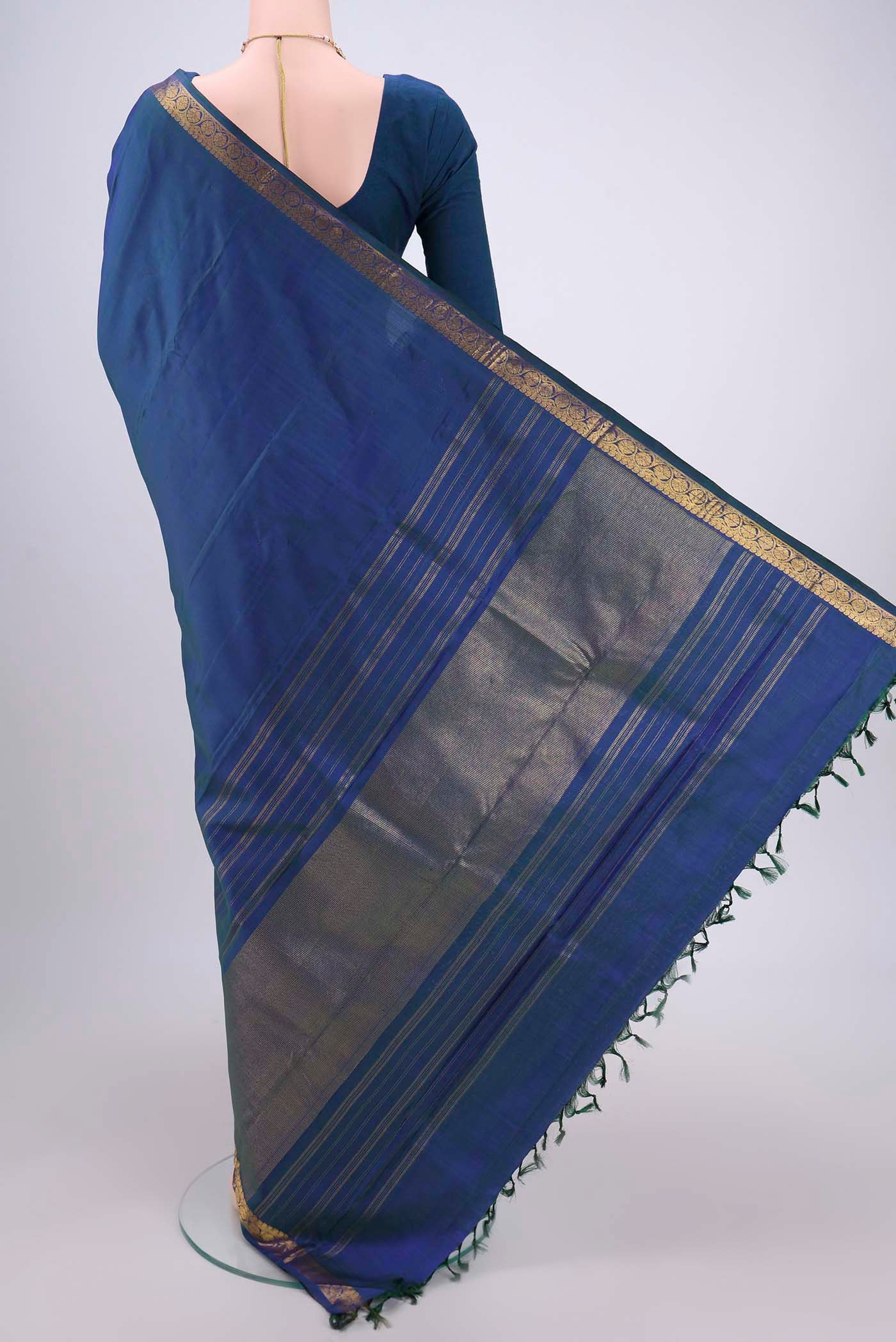 Flat view of Peacock Blue Dual Tone Kanjivaram Silk Saree with Plain Body and Zari Border. 