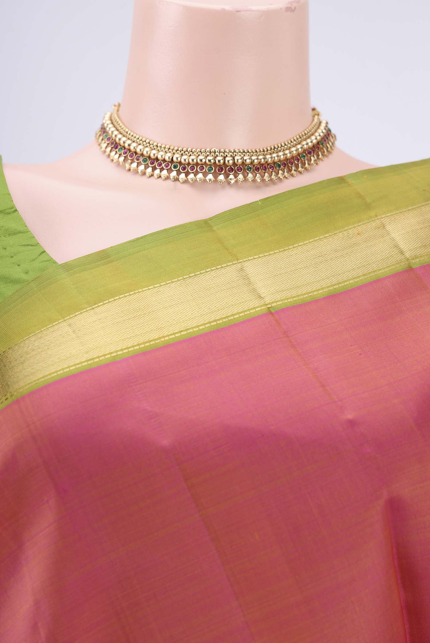 Border image of Brick Orange Dual Tone Kanjivaram Silk Saree with Plain Body and Zari Border. 