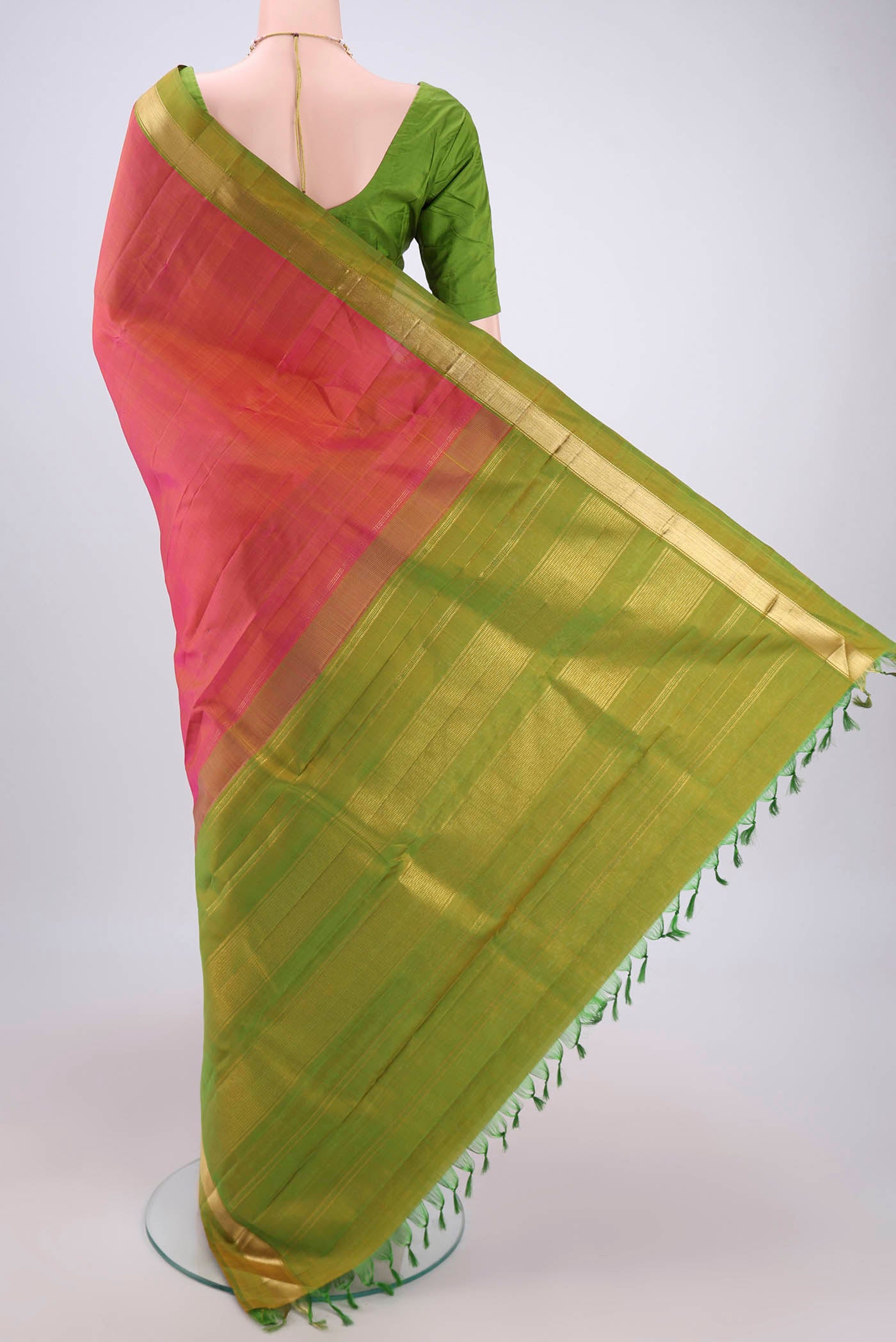 Flat view of Brick Orange Dual Tone Kanjivaram Silk Saree with Plain Body and Zari Border. 