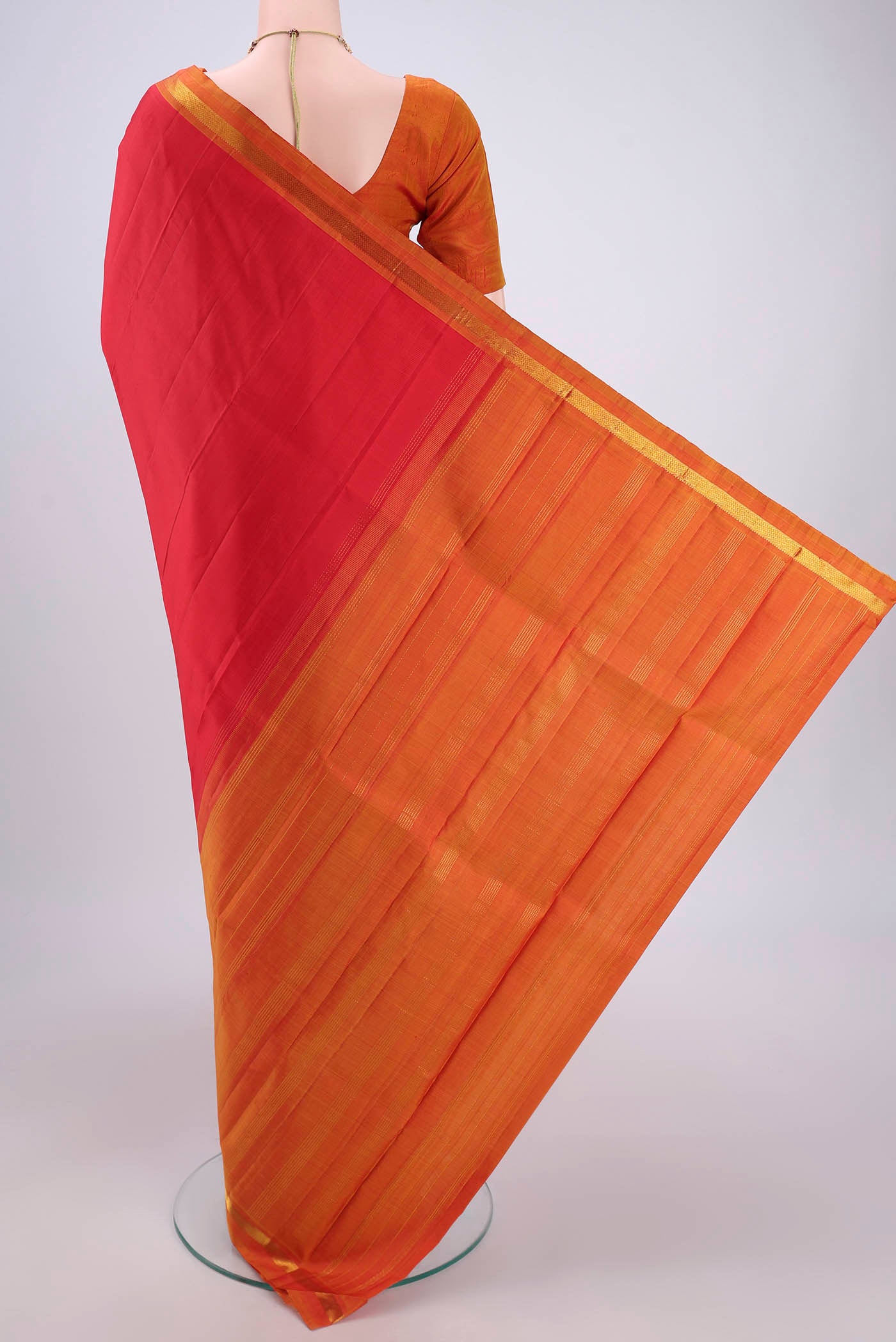 Flat view of Red Kanjivaram Silk Saree with Plain Body and Zari Border. 