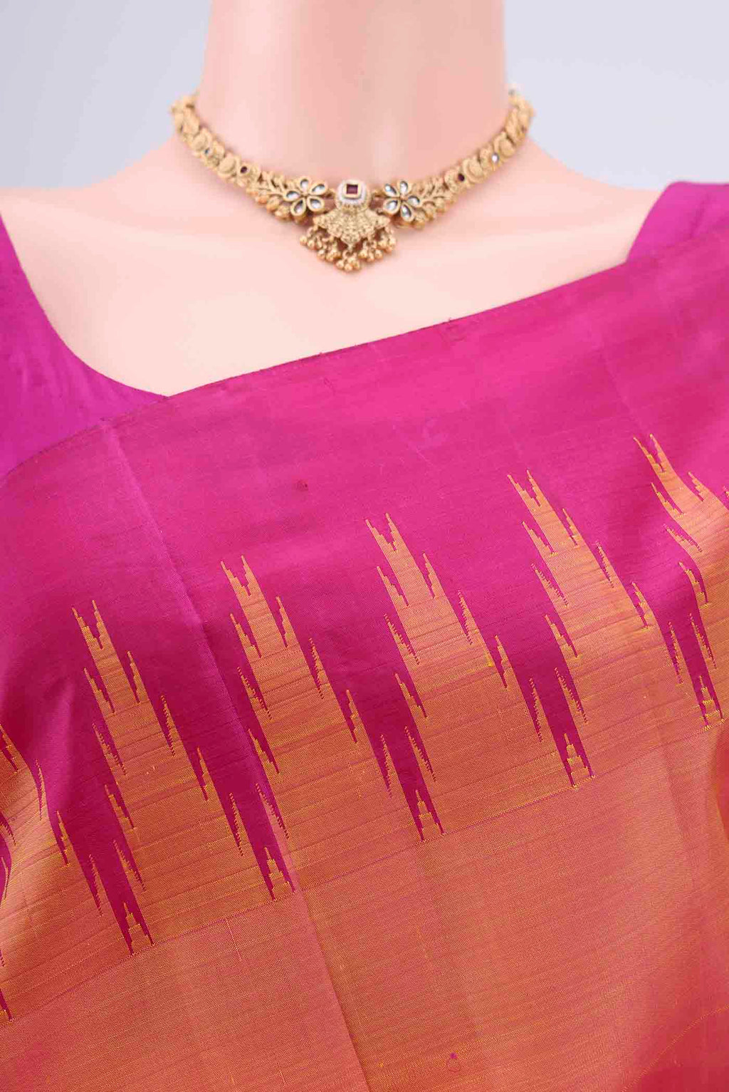 Border image of Peach Kanchipuram Silk Saree with Plain Body and Temple Border. 