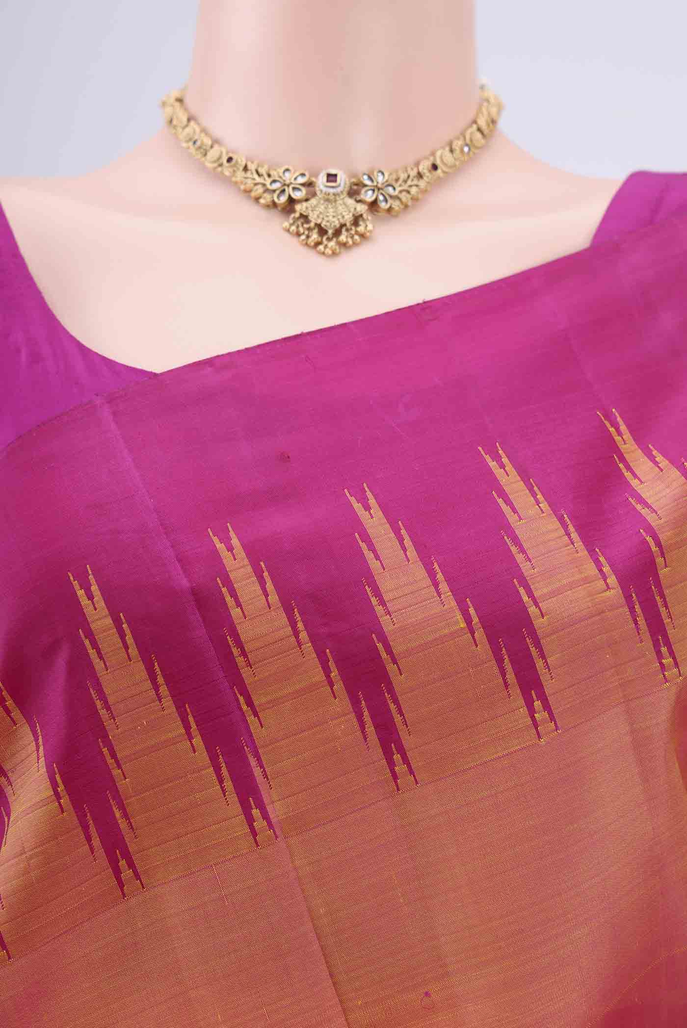 Border image of Peach Kanchipuram Silk Saree with Plain Body and Temple Border. 