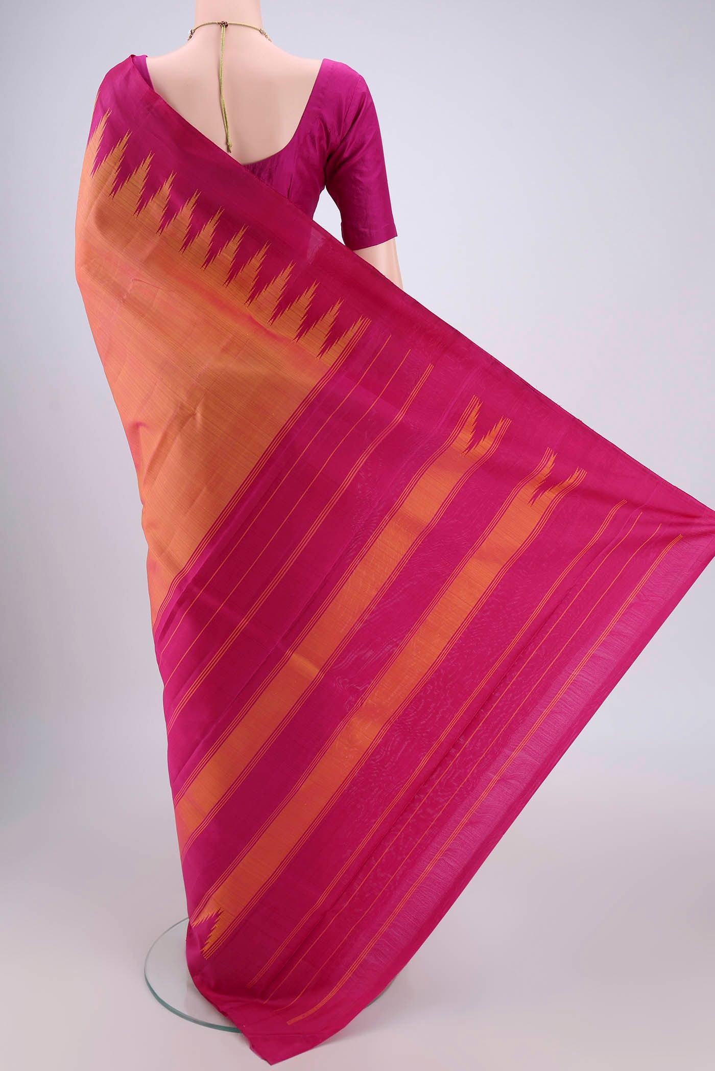 Flat view of Peach Kanchipuram Silk Saree with Plain Body and Temple Border. 