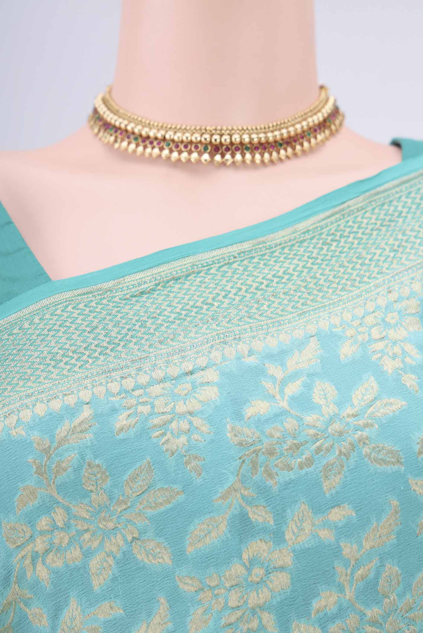 Border image of Turquoise Banarasi Georgette Saree with Zari Brocade on the body and Zari Border. 