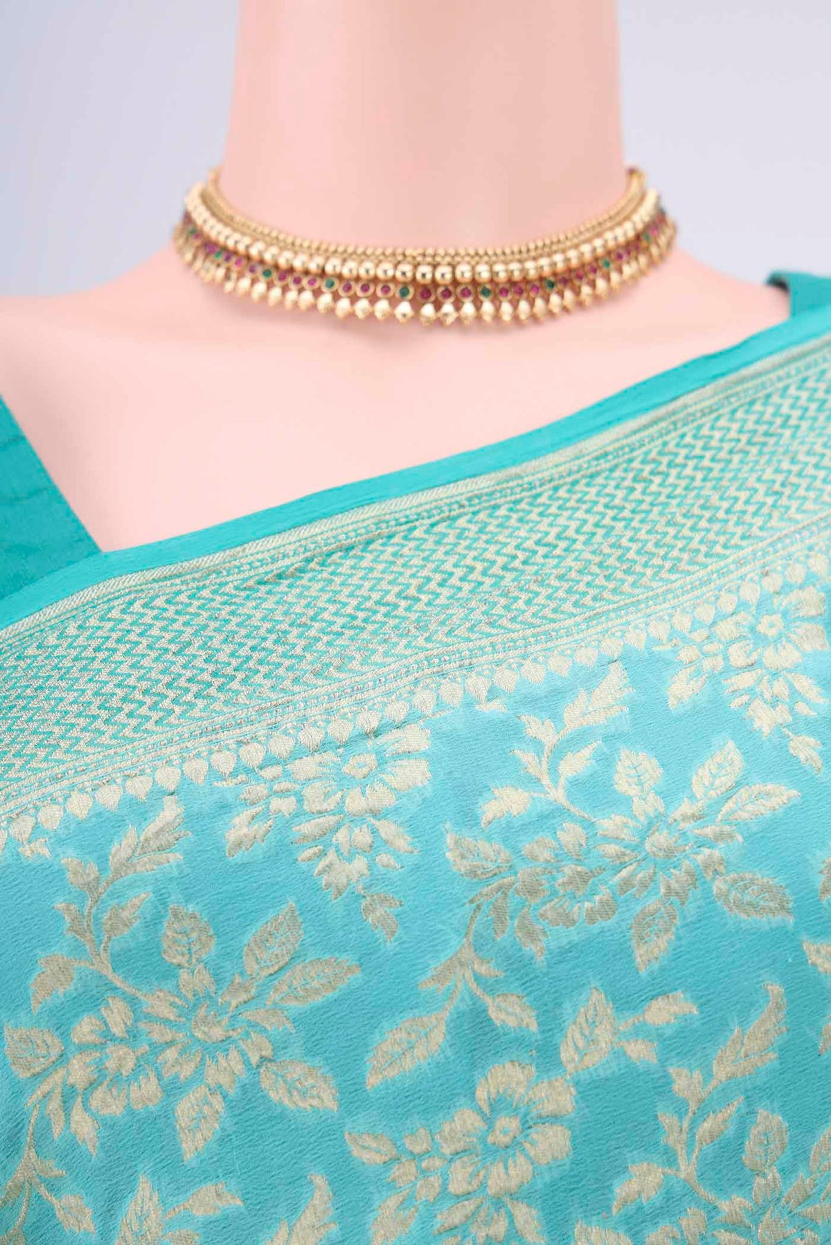 Border image of Turquoise Banarasi Georgette Saree with Zari Brocade on the body and Zari Border. 
