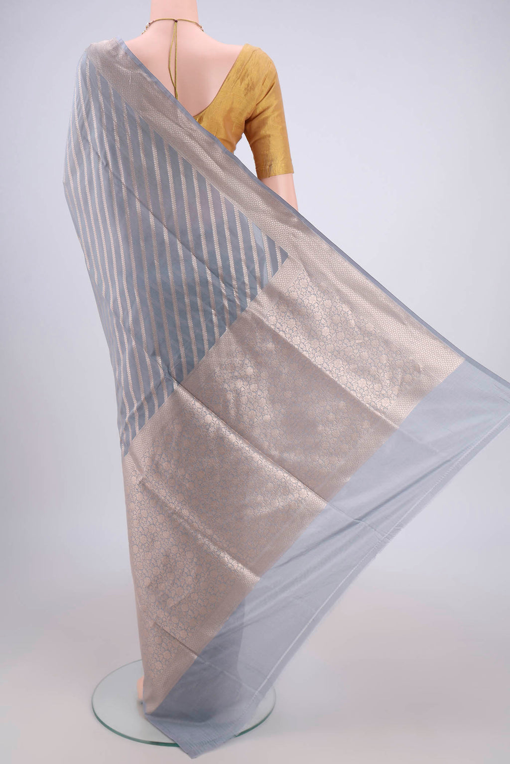 Flat view of Blue Grey Banarasi Silk Saree with Stripes on the body and Zari Border. 